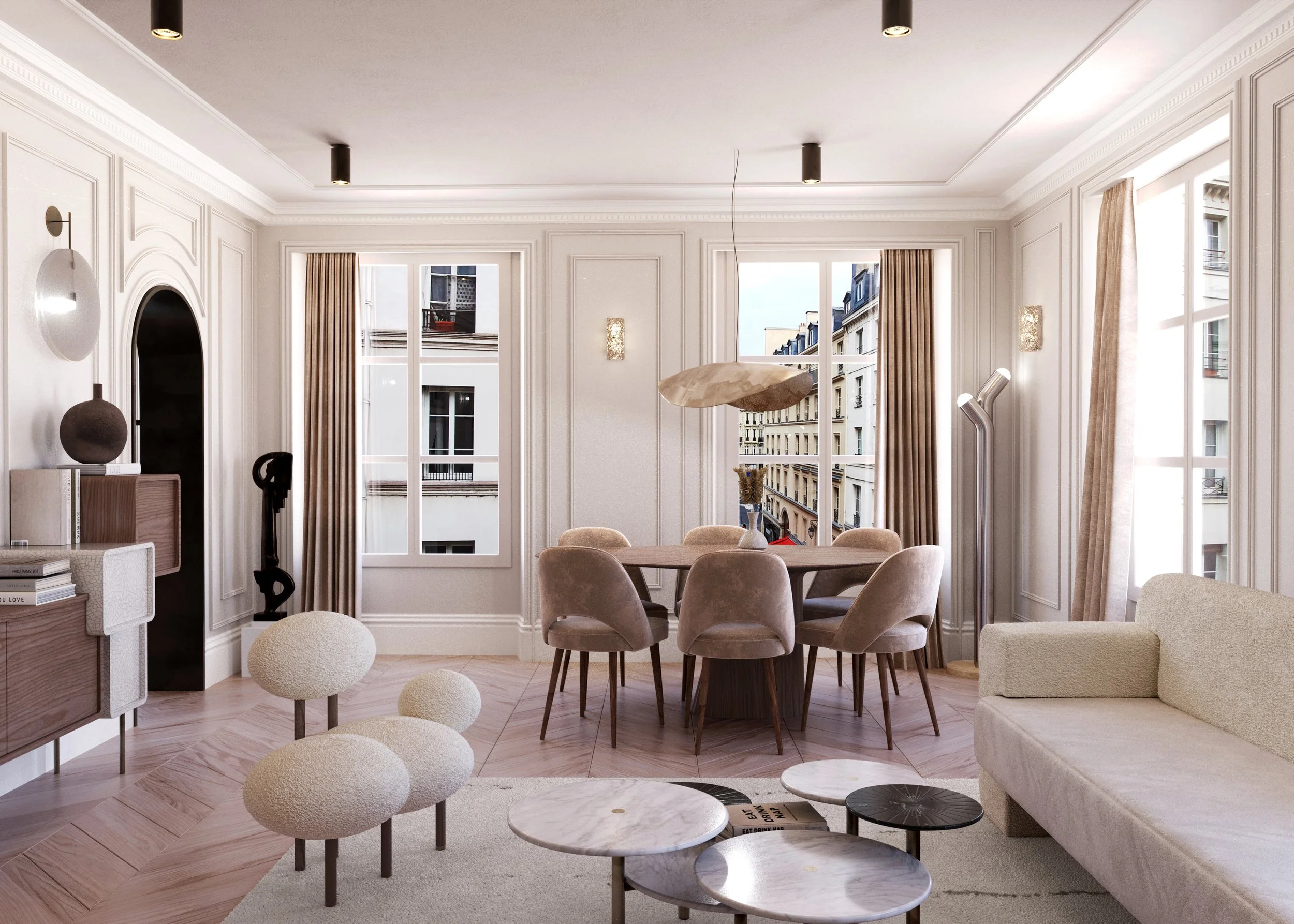 Bright living room with beige sofas, round dining table, large windows, modern decor with sculptures, white and beige color palette, view of the buildings through the windows.