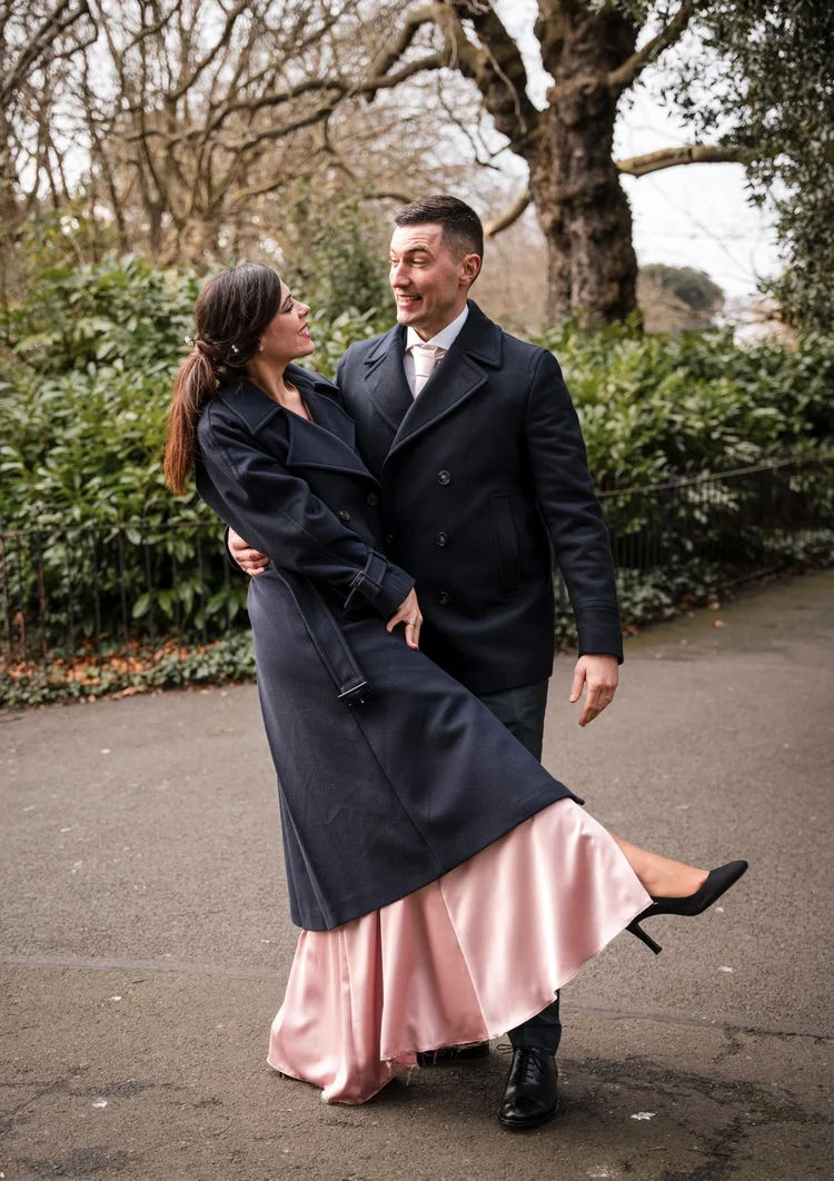 Newlyweds embracing in a Dublin park on their wedding day
