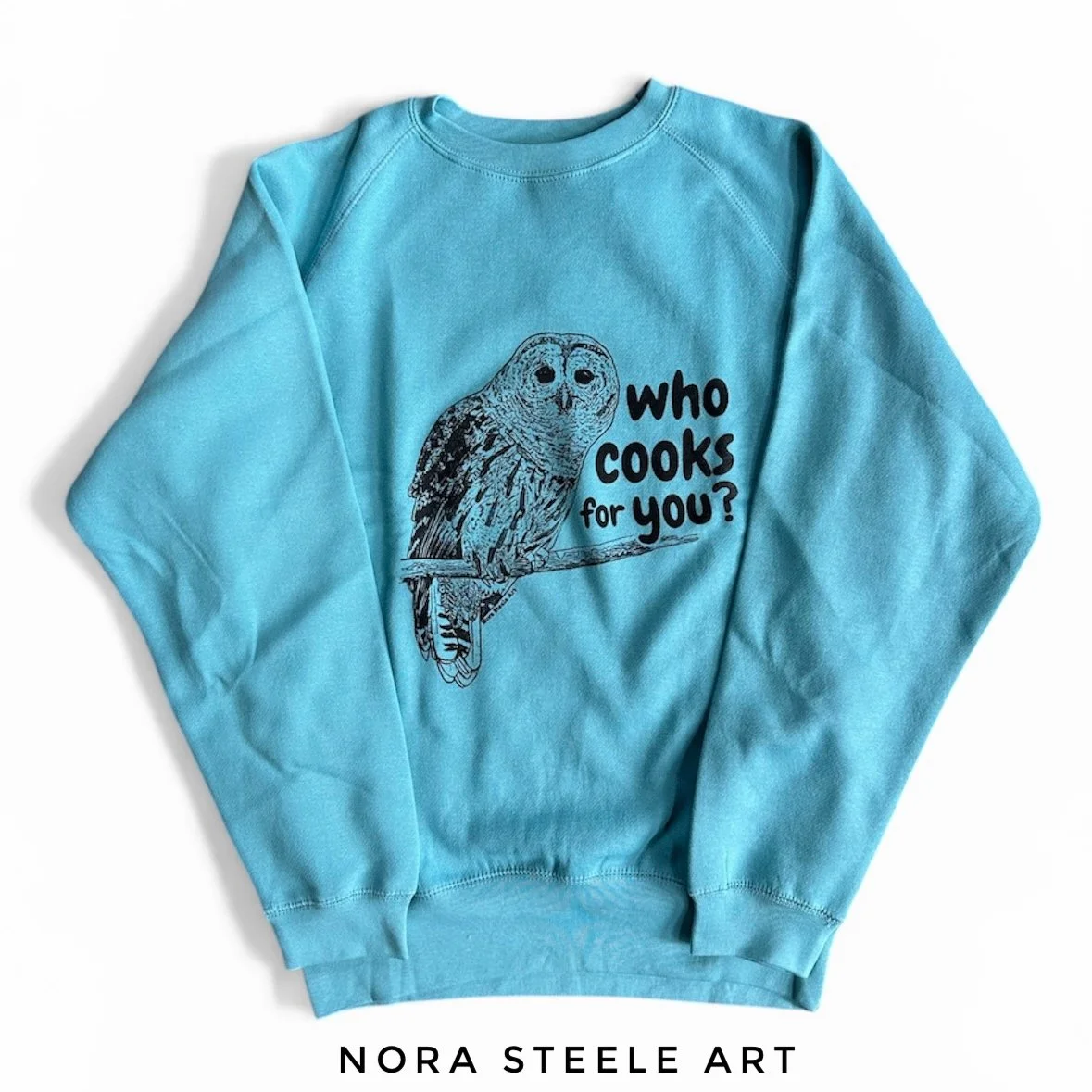 Sweatshirt screenprinted with a barred owl and text saying "who cooks for you?"