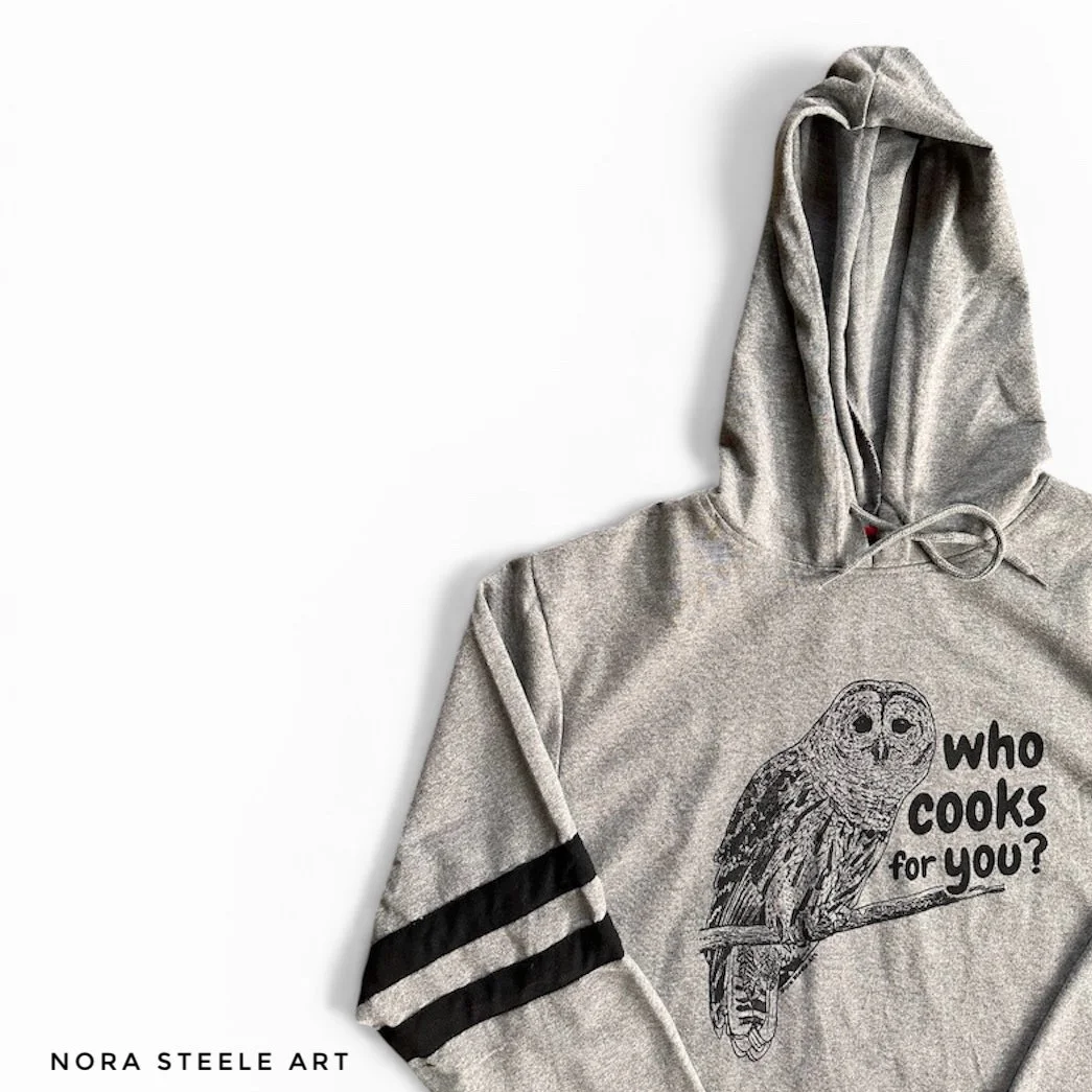 Long-sleeve shirt screenprinted with a barred owl and text saying "who cooks for you?"