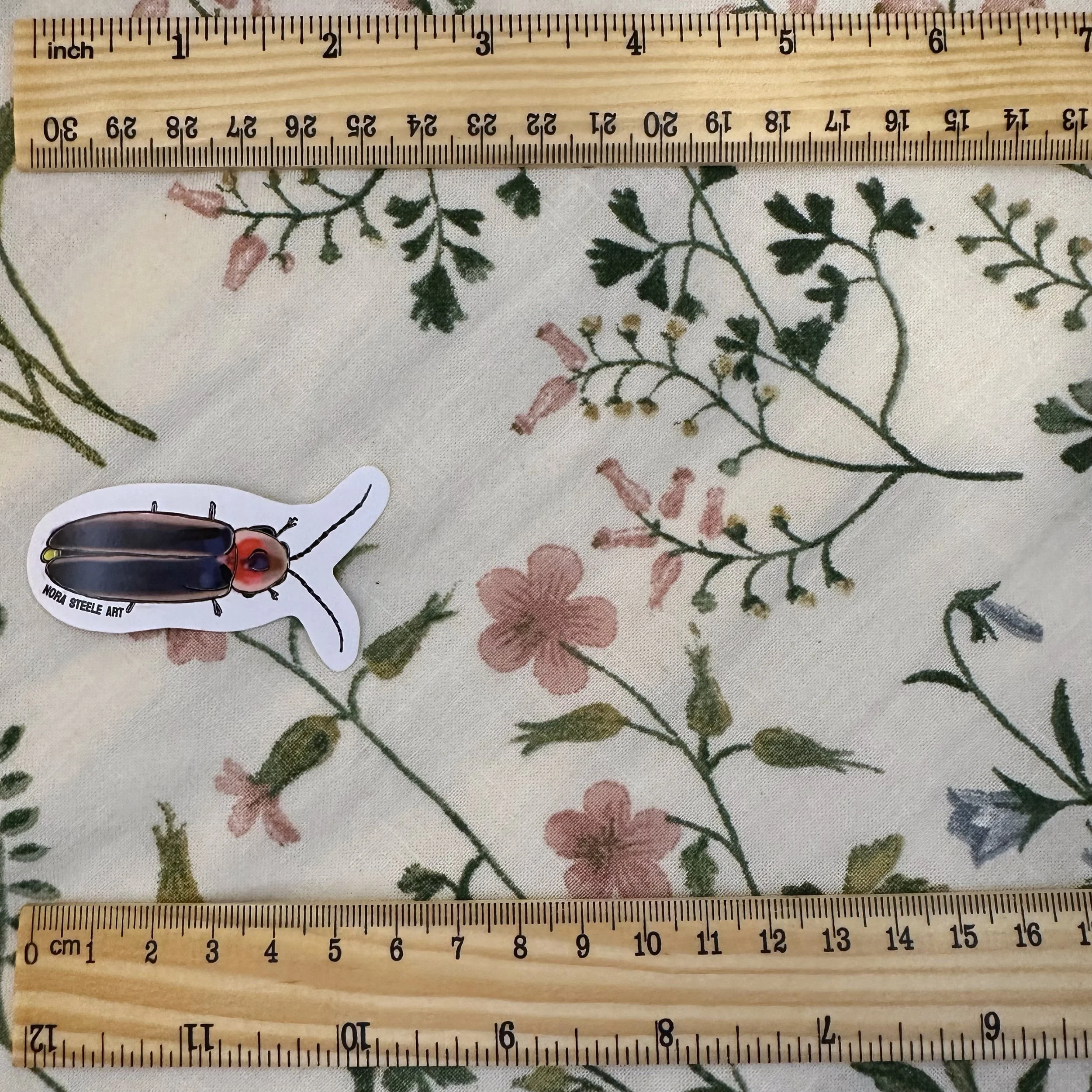 Firefly sticker measuring 2 1/4 inches long