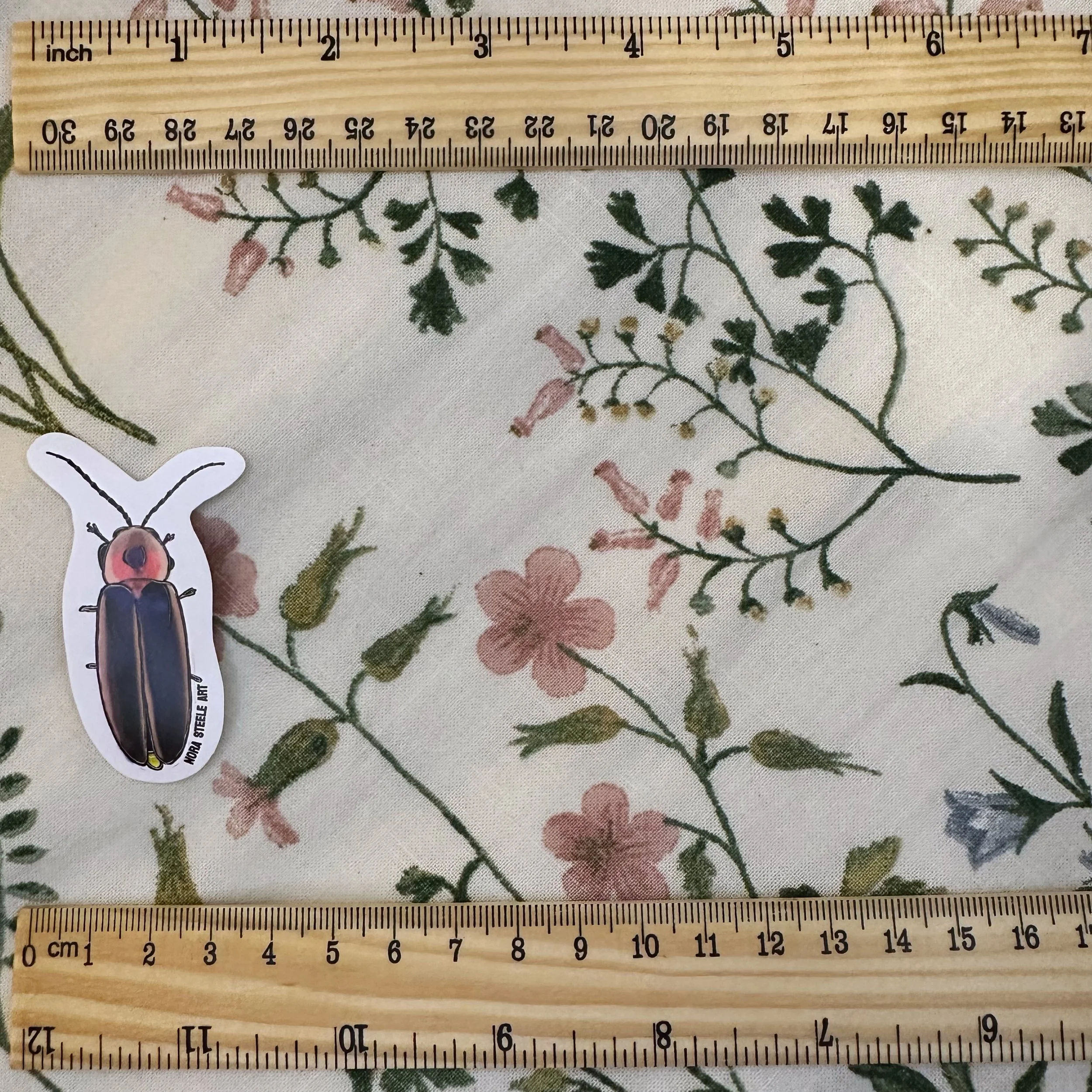Firefly sticker measuring 1 1/2 inches wide