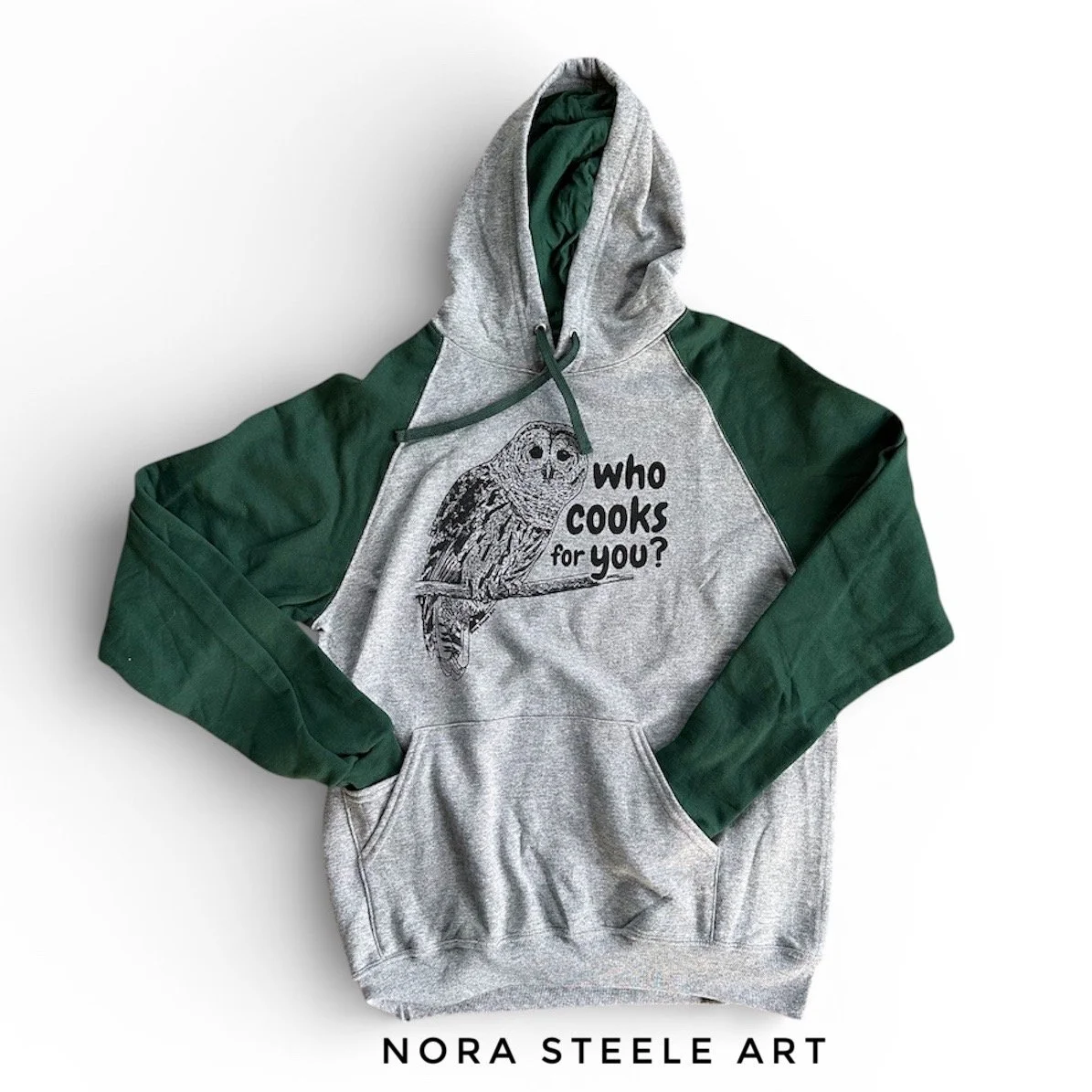 Hoodie screenprinted with a barred owl and text saying "who cooks for you?"