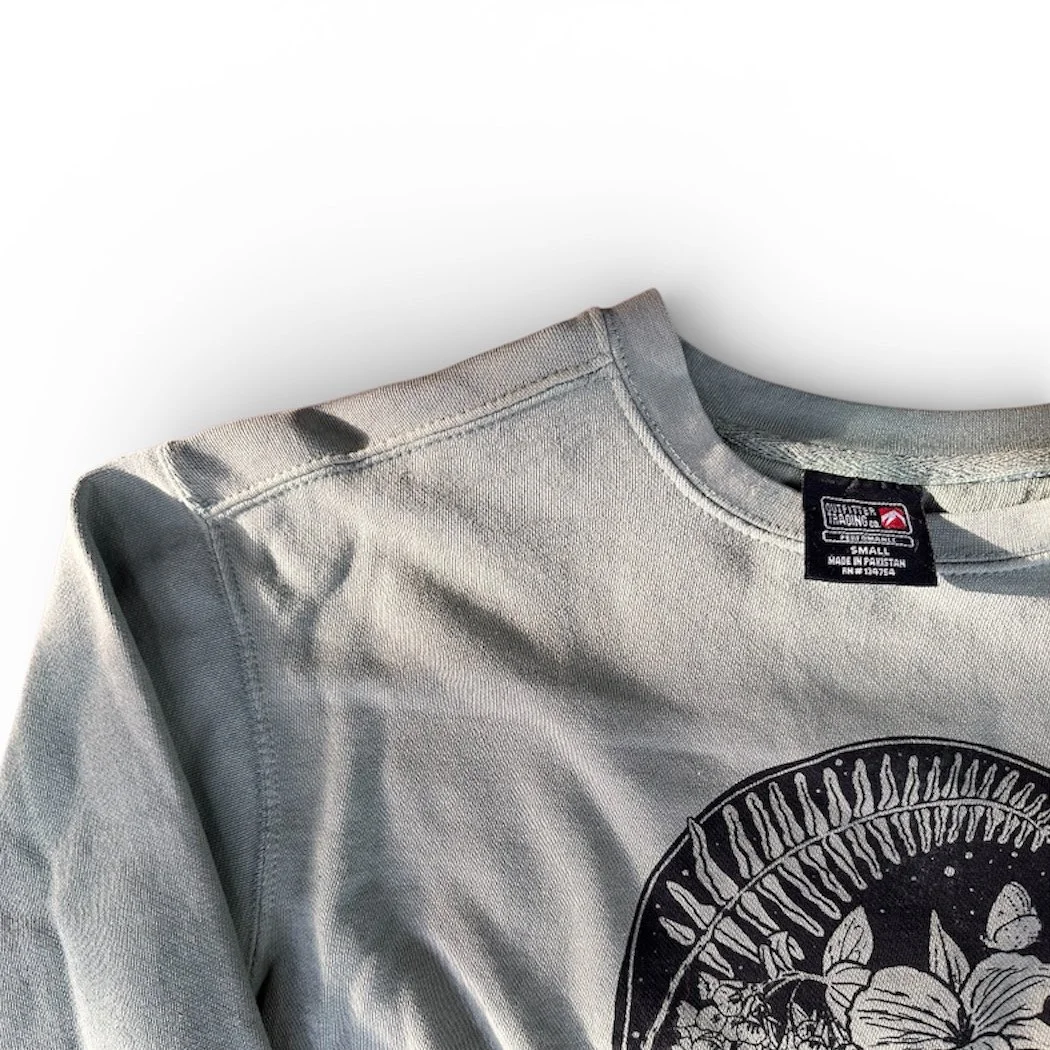 Sweatshirt tag saying "Outfitter trading co."