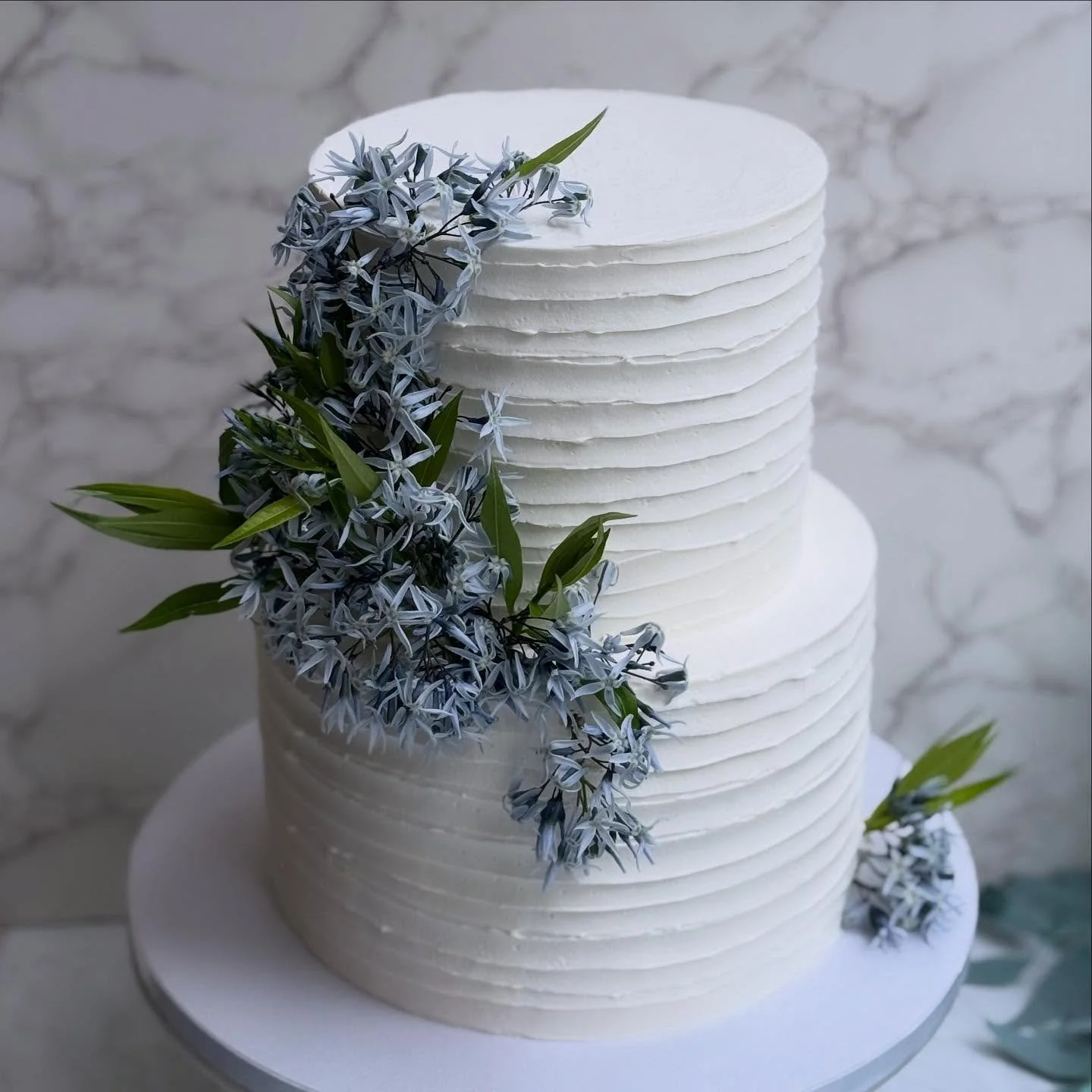 Chocolate cake, vanilla buttercream, and @wildlyfloral.co flowers for a baby shower!