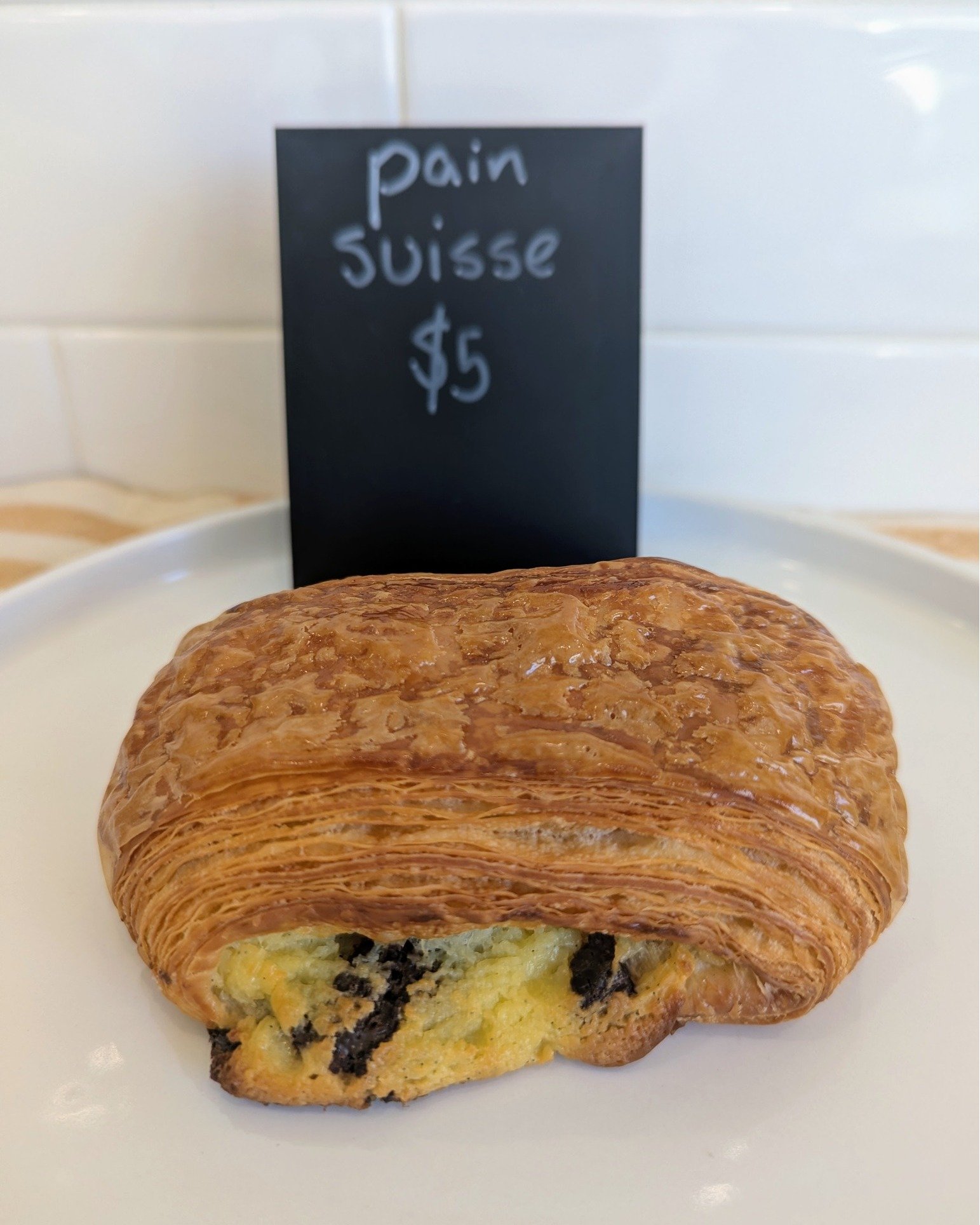 In the case this week: Pain Suisse (flaky croissant, vanilla pastry cream, and chocolate chips)