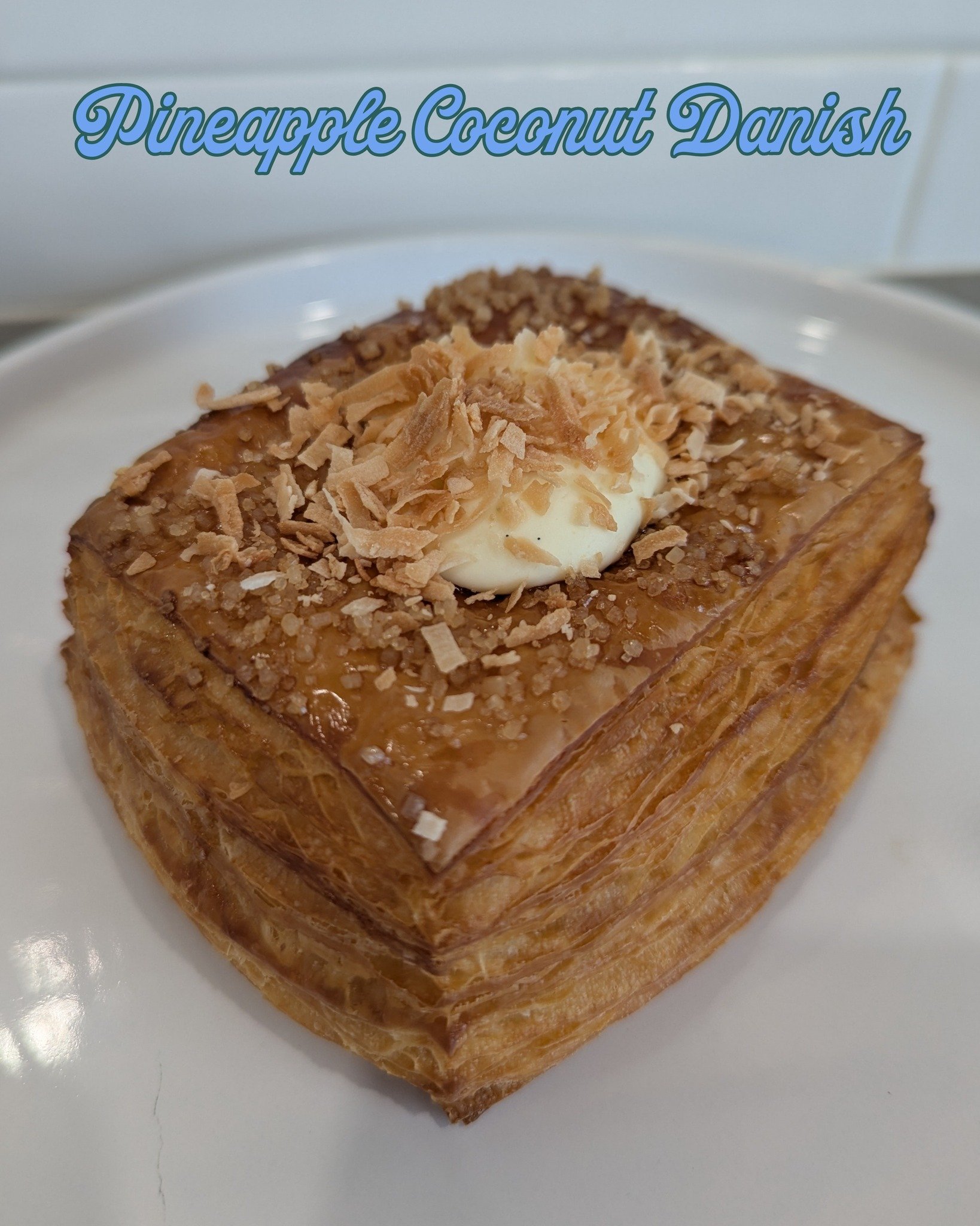 In the case this week: Pineapple Coconut Danish
 
Roasted pineapple caramel, vanilla bean diplomat cream, and toasted coconut. Take a bite and pretend it's not 40&deg; and raining!
