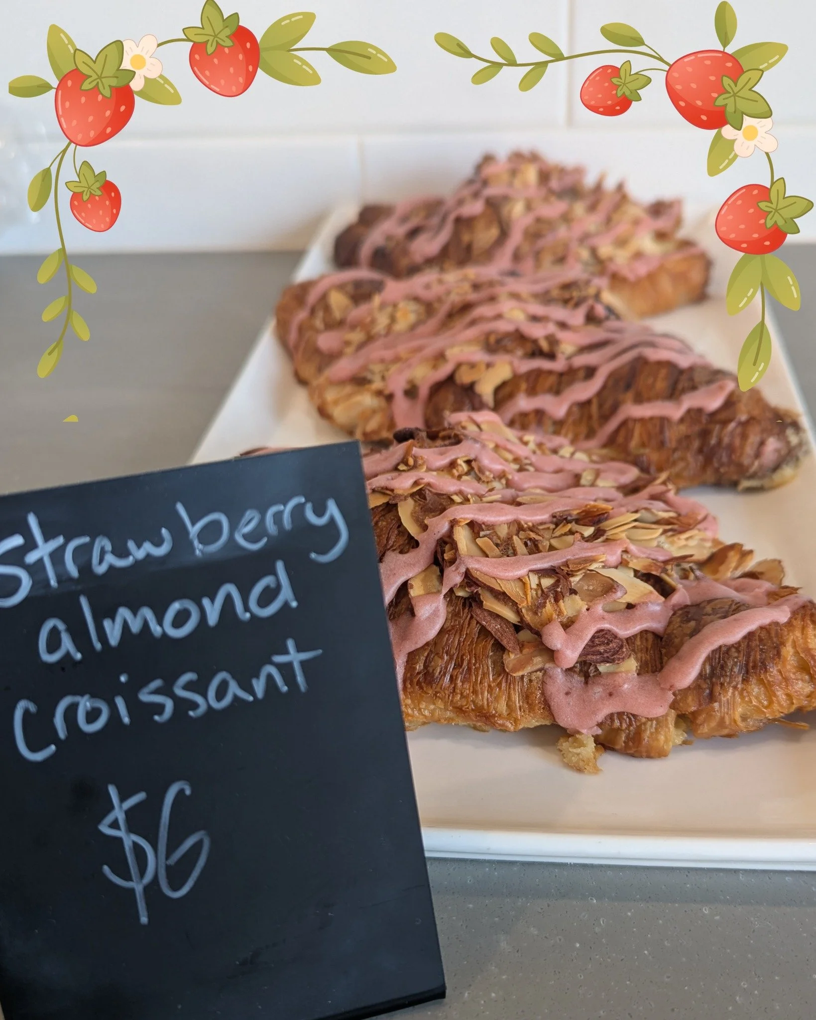Strawberry Almond Croissant: Twice baked croissant dipped in rum milk, sliced and filled with frangipane and strawberry jam made with local @redwinefamilyfarmsllc strawberries. Topped with sliced almonds and strawberry drizzle. In the shop this week 