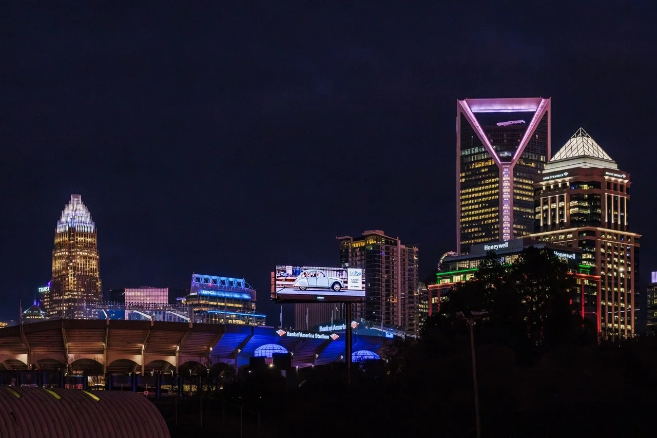 ArtPop Street Gallery Cities Program Class of 2024 Adams Digital Billboard Charlotte NC Skyline Dusk Lauren Gibson.jpeg