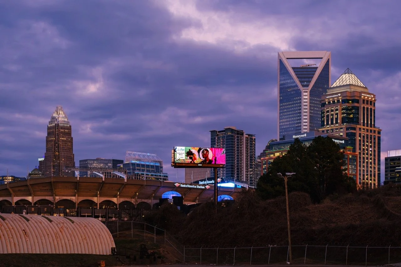 ArtPop Street Gallery Cities Program Class of 2024 Adams Digital Billboard Charlotte NC Skyline Dusk Malaysha K Belton.jpeg