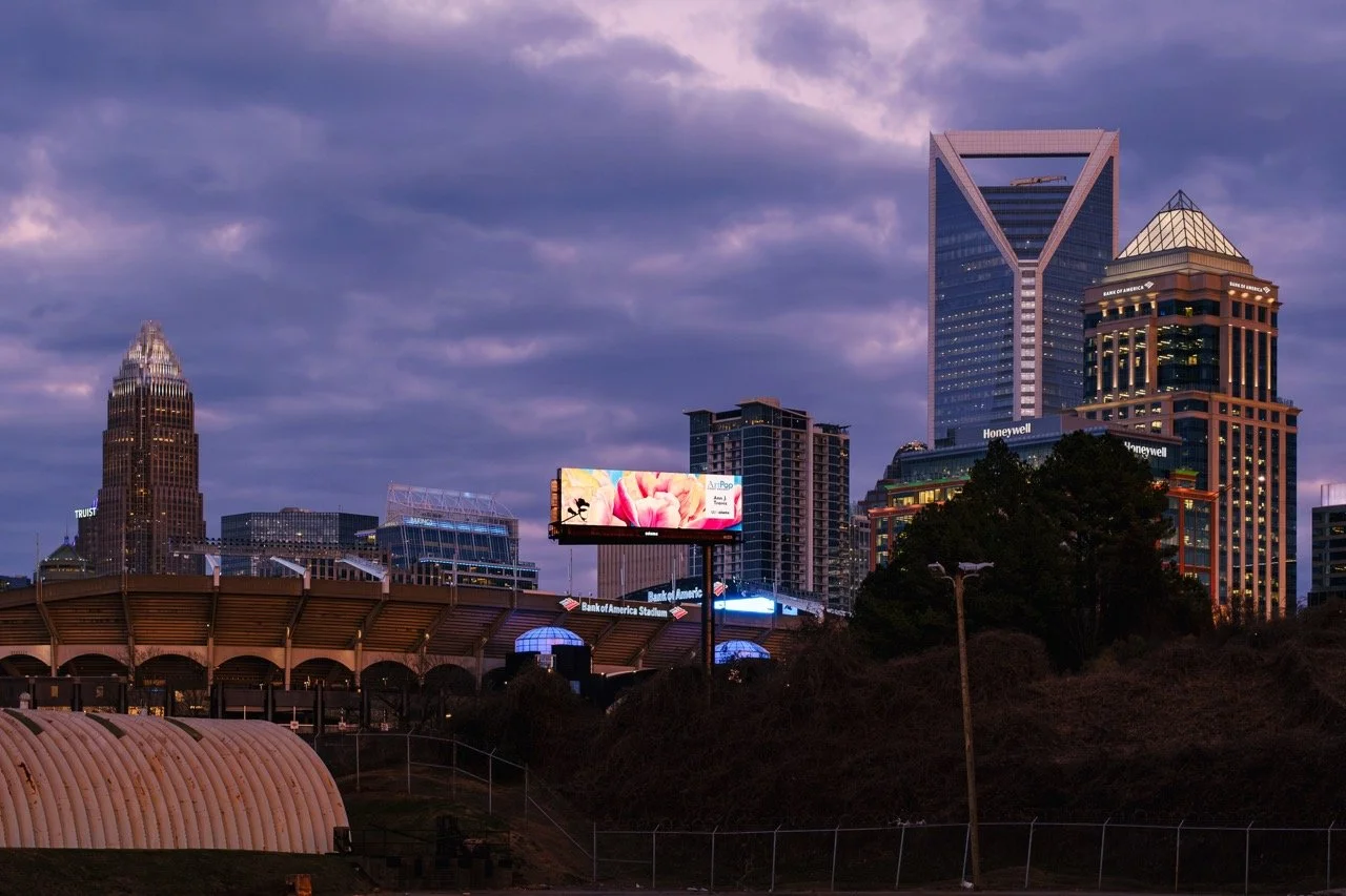 ArtPop Street Gallery Cities Program Class of 2024 Adams Digital Billboard Charlotte NC Skyline Dusk Ann J Travis.jpeg