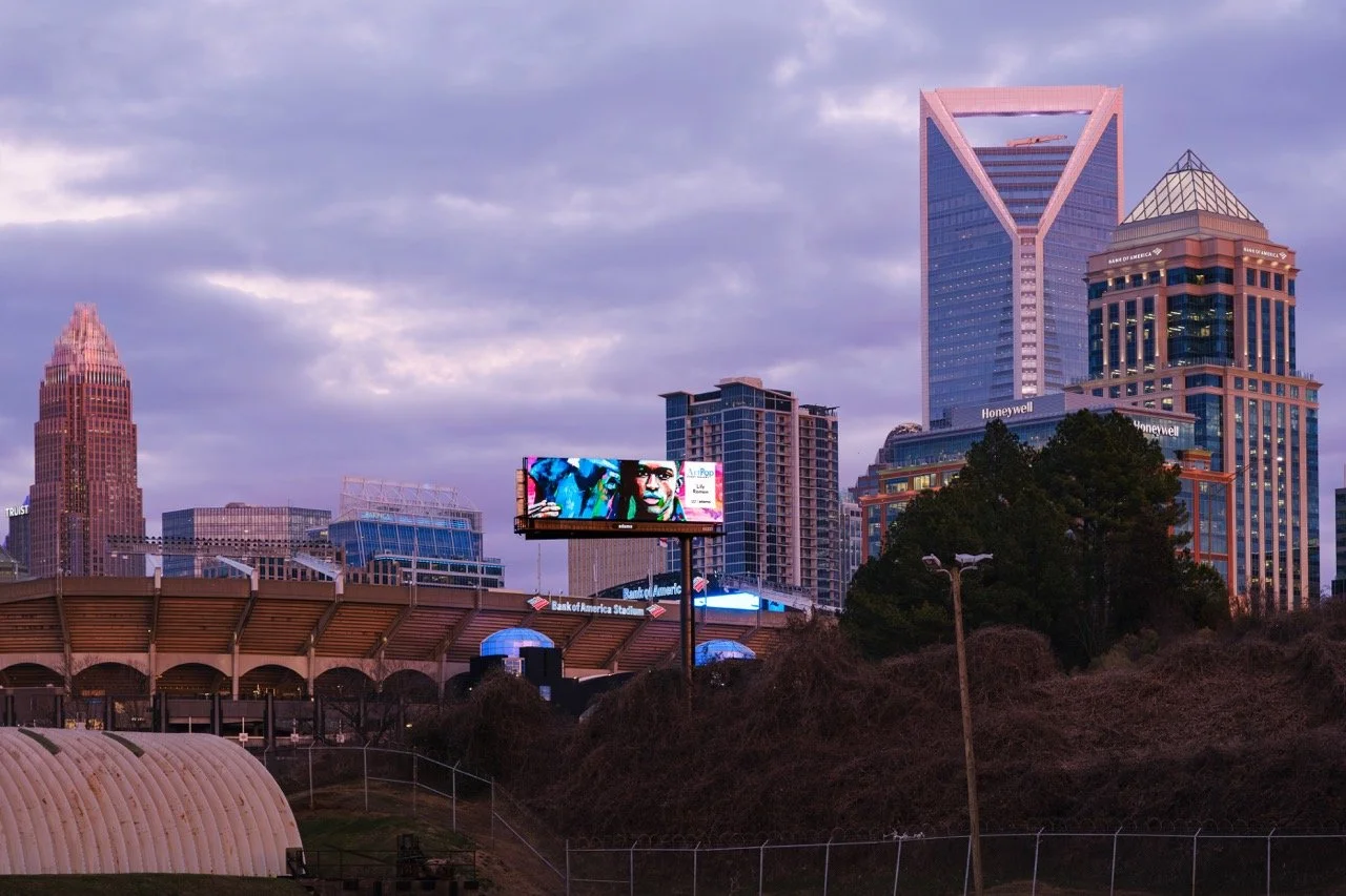 ArtPop Street Gallery Cities Program Class of 2024 Adams Digital Billboard Charlotte NC Skyline Dusk Lily Roman.jpeg