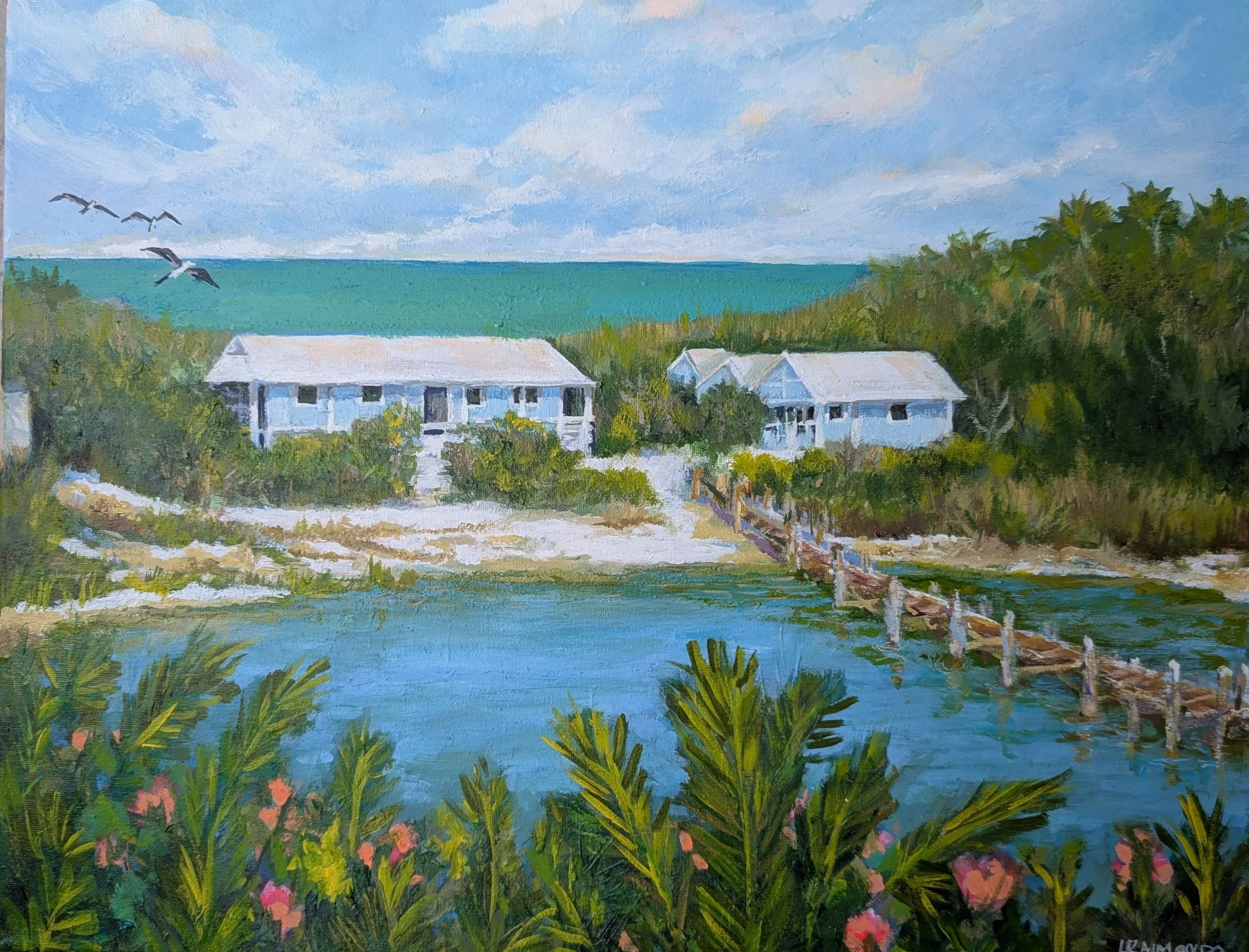 Painting of a beach scene with blue sky, clouds, seagulls flying, and white houses surrounded by greenery and colorful flowers.