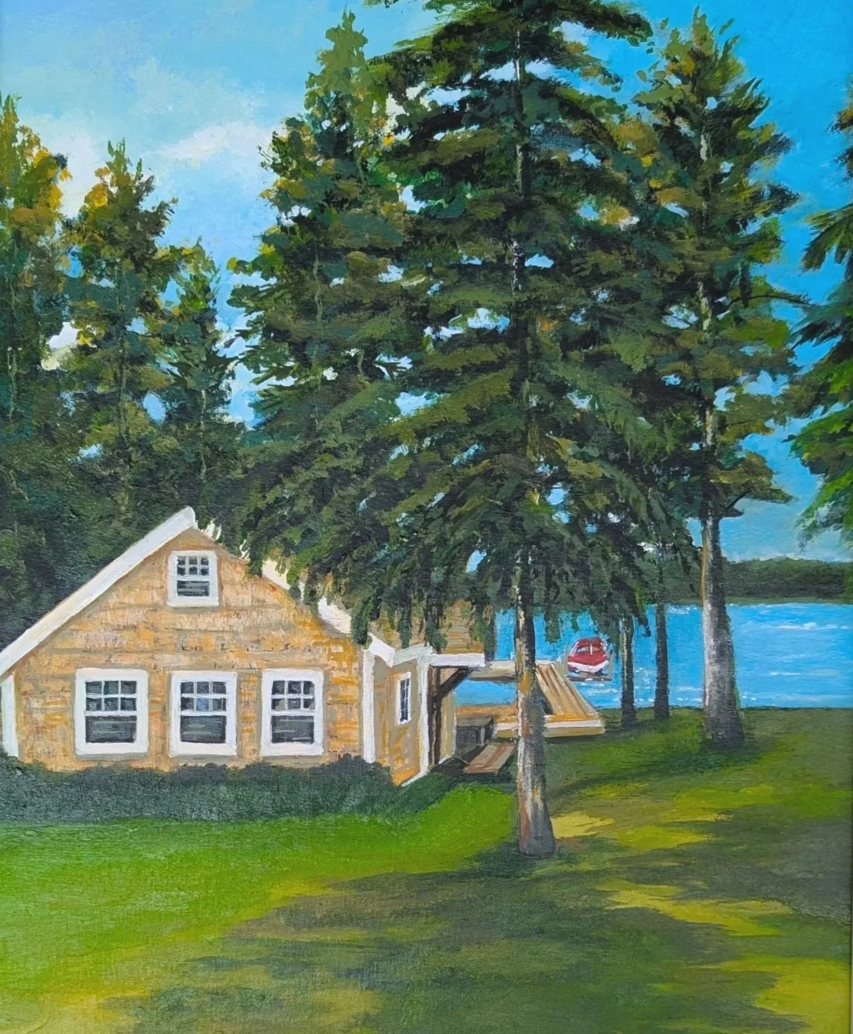 A house with a thatched roof, white window frames, and a porch, surrounded by green grass, tall trees, and a blue sky with some clouds.