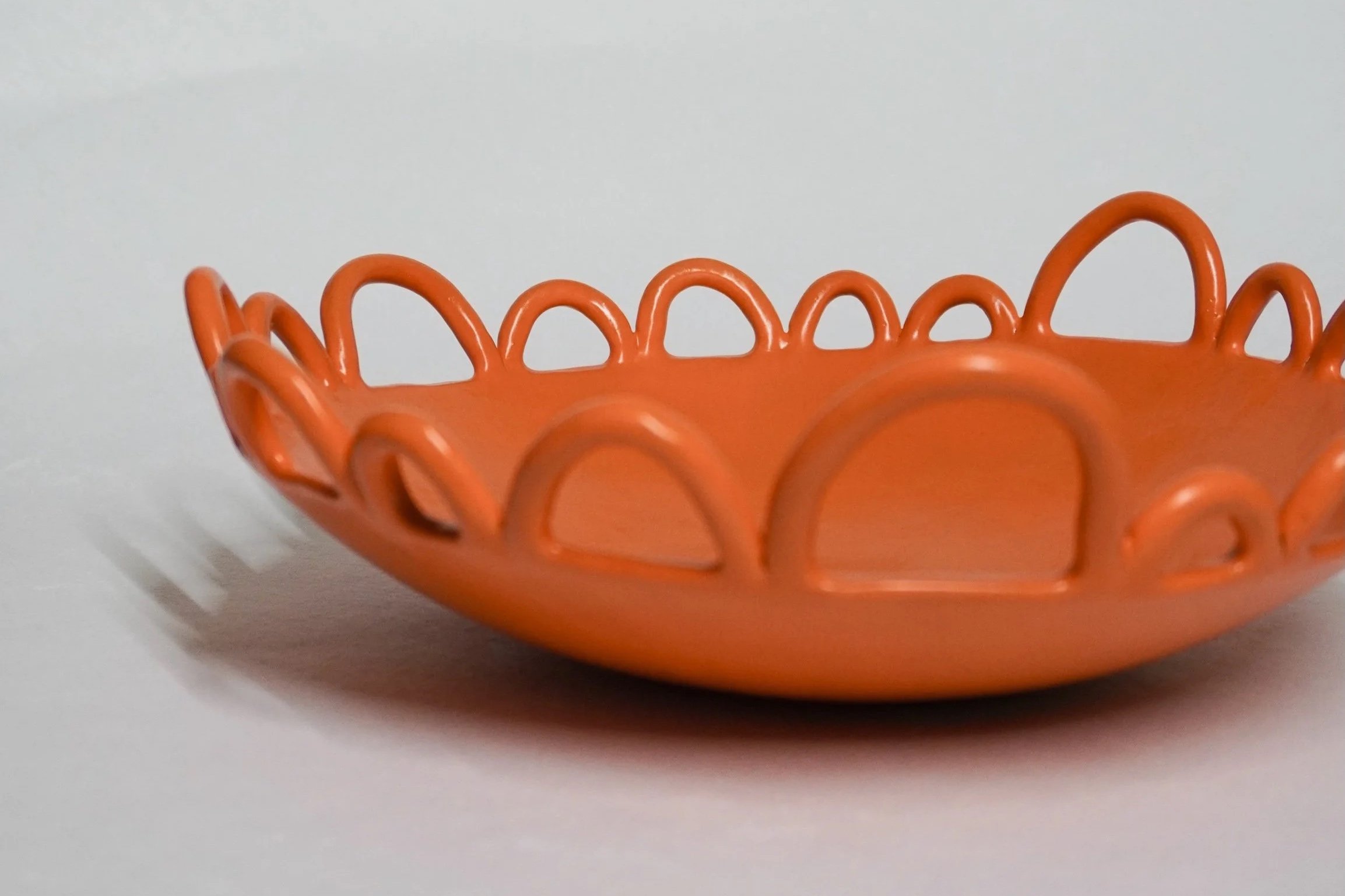 Tangerine orange fruit bowl with loops
