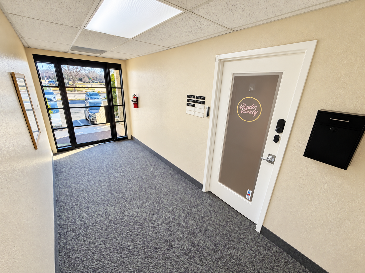 Professional office hallway with carpeted flooring and private office entrances at 720 W. Harwood Road in Hurst, Texas.