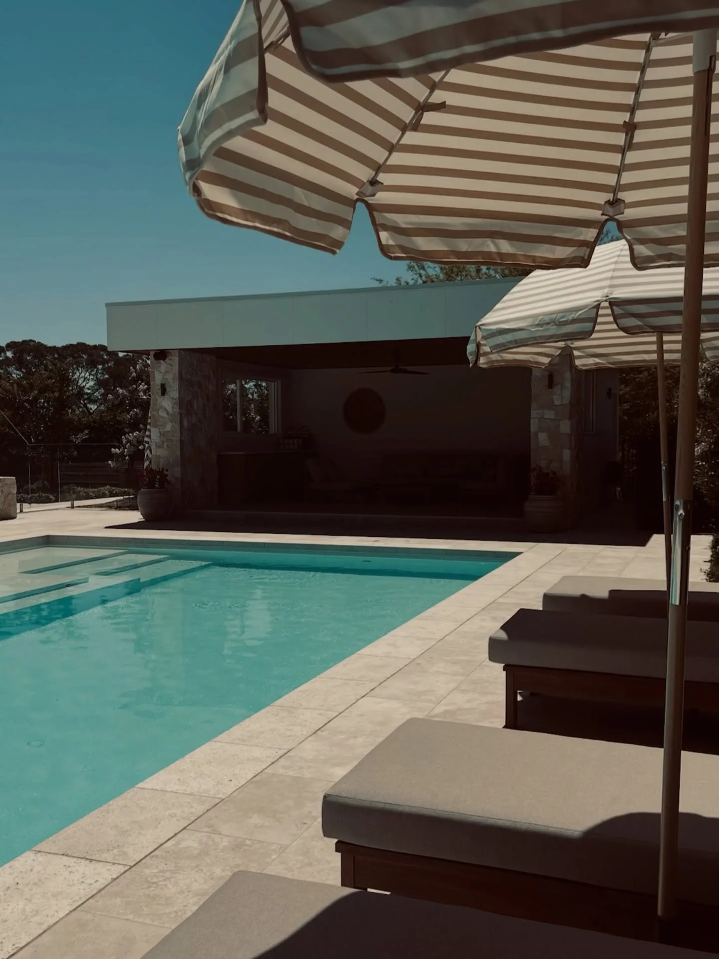 Perfect for lazy summer days 😎

This pool and outdoor living designed by @fluidlandscapedesign 
Pool constructed by @splishsplashpools 

#poolside #outdoordesign #designerpool #landscapedesigner