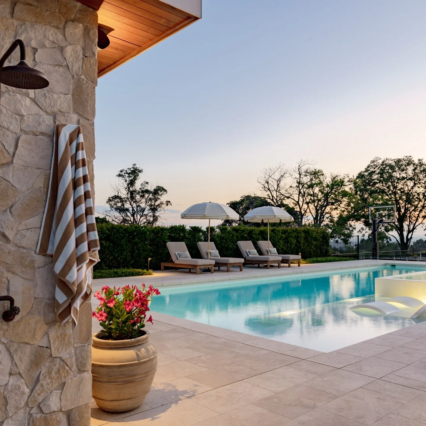 Sun-drenched stone, bright potted colour, and a pool that feels like it belongs in the Tuscan hills&hellip;🌿 

But this little slice of Europe? It&rsquo;s right here in northwest Sydney. 

We designed this space to slow things down. With soft textur