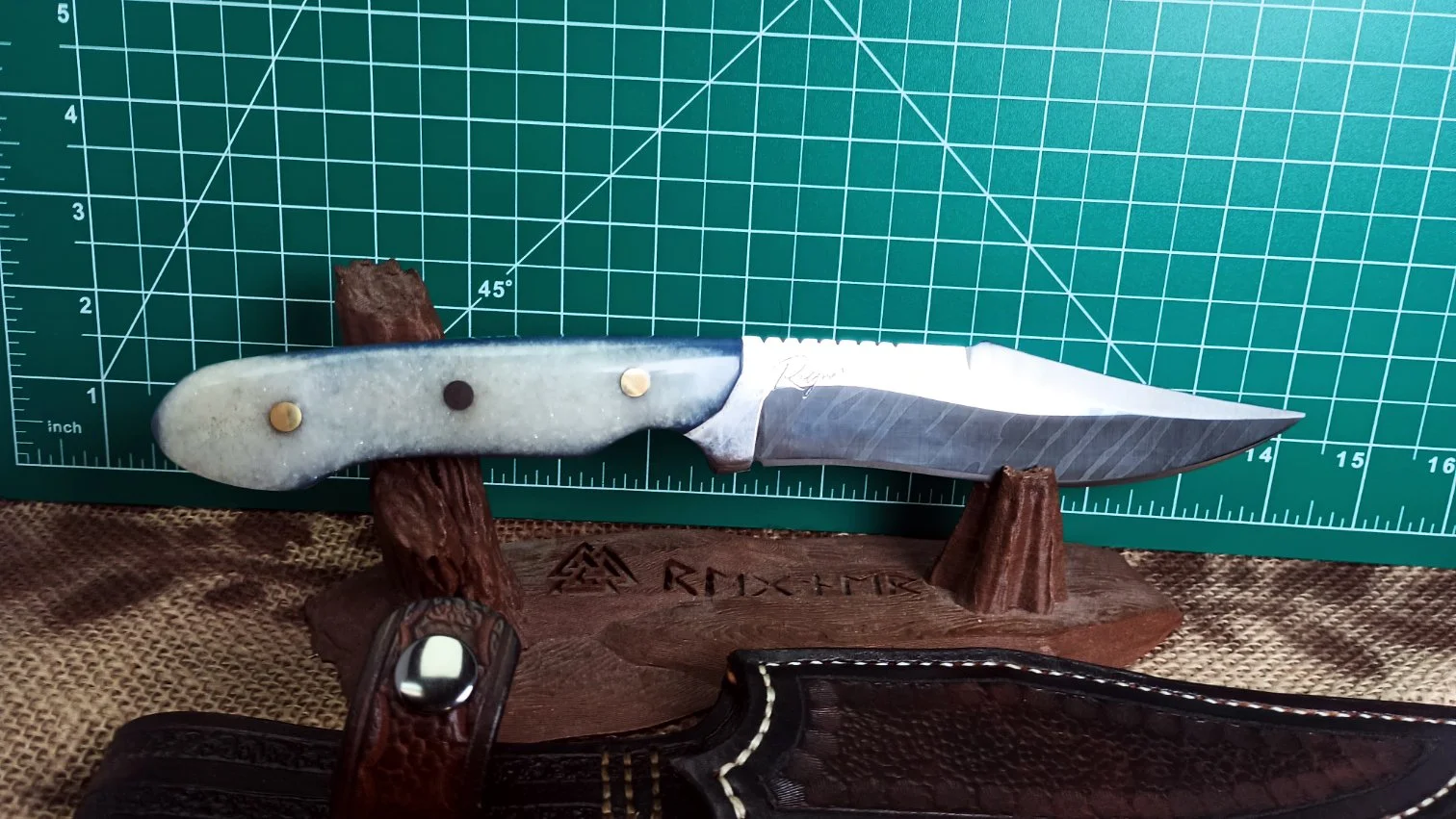 Blue Frost Rapscallion in 1095 steel and custom made resin handle scales