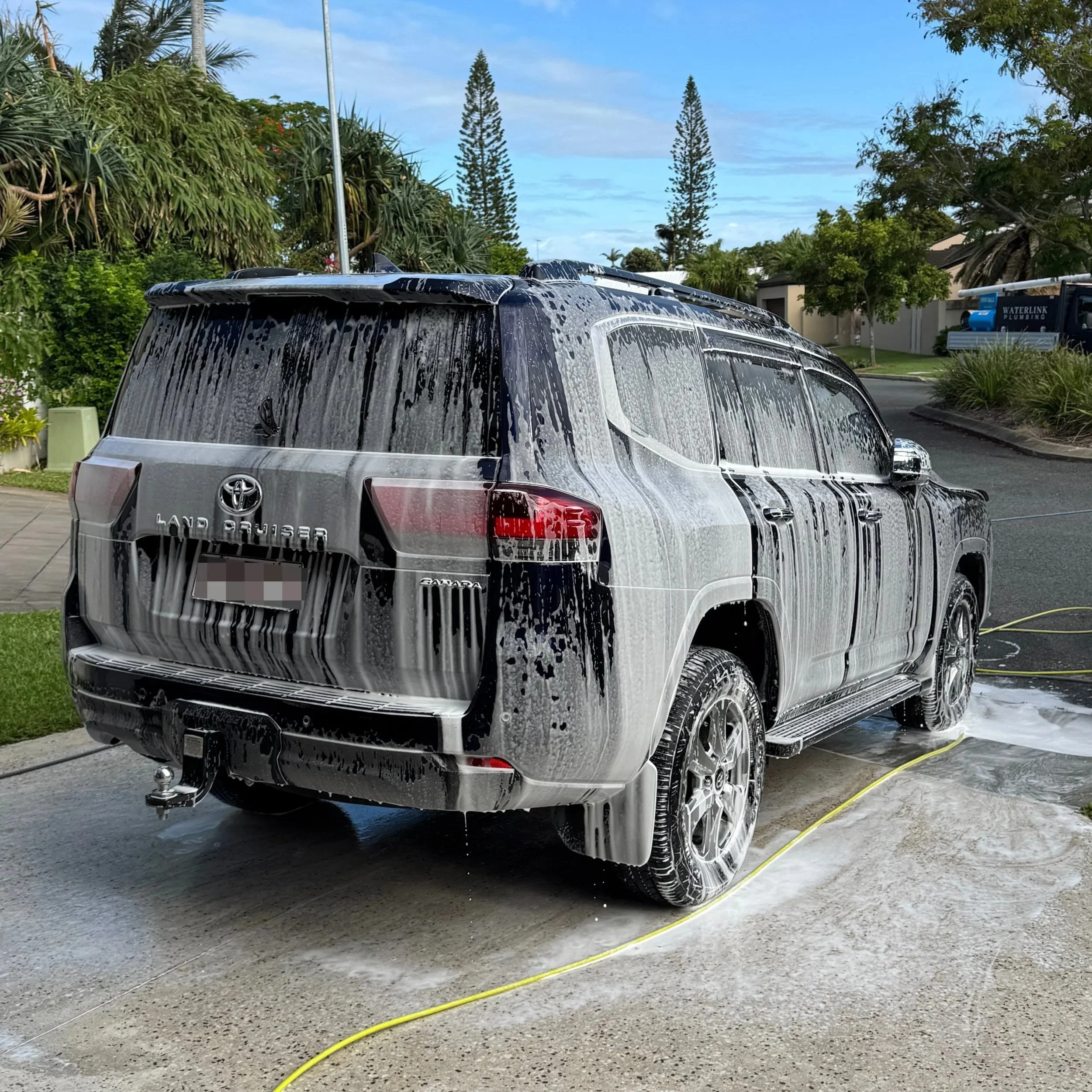 Toyota Land Cruiser covered in Snow Foam while receiving a mobile detailing service from The Auto Detailers on The Gold Coast.