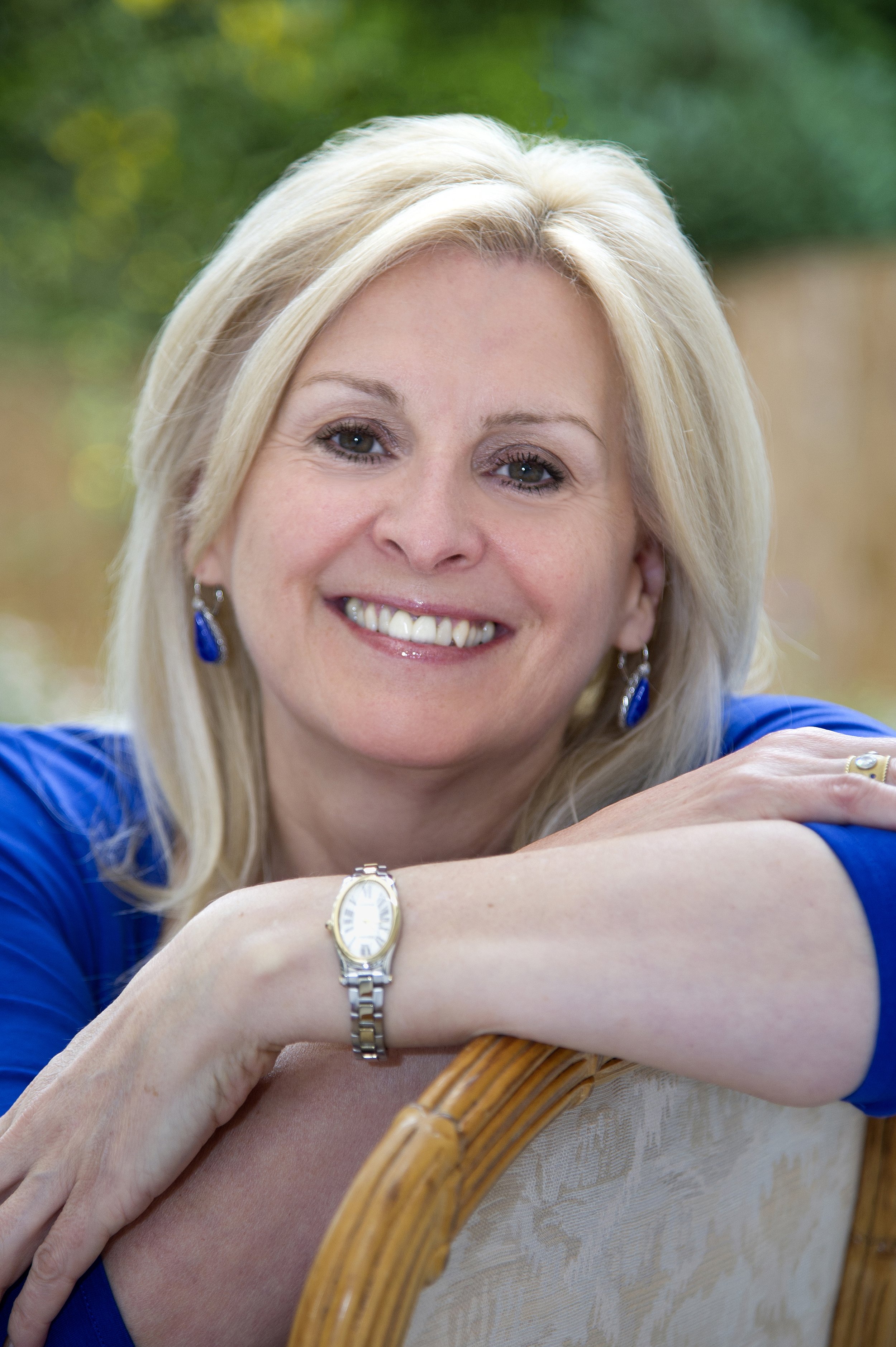 Business headshot photography female smiling at camera.