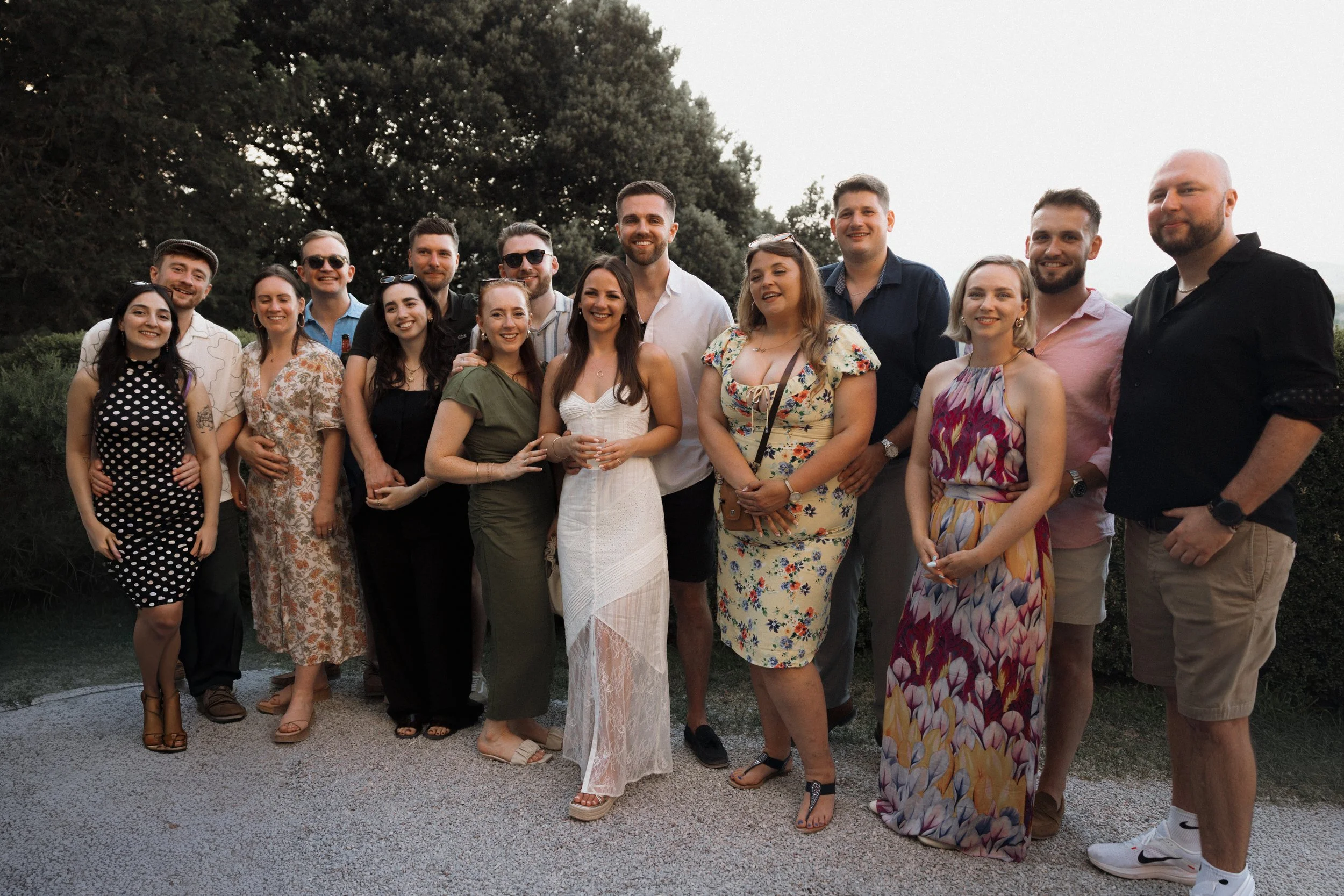 Bride and guests enjoying a pizza welcome party at Borgo di Pietrafitta in Tuscany, Italy