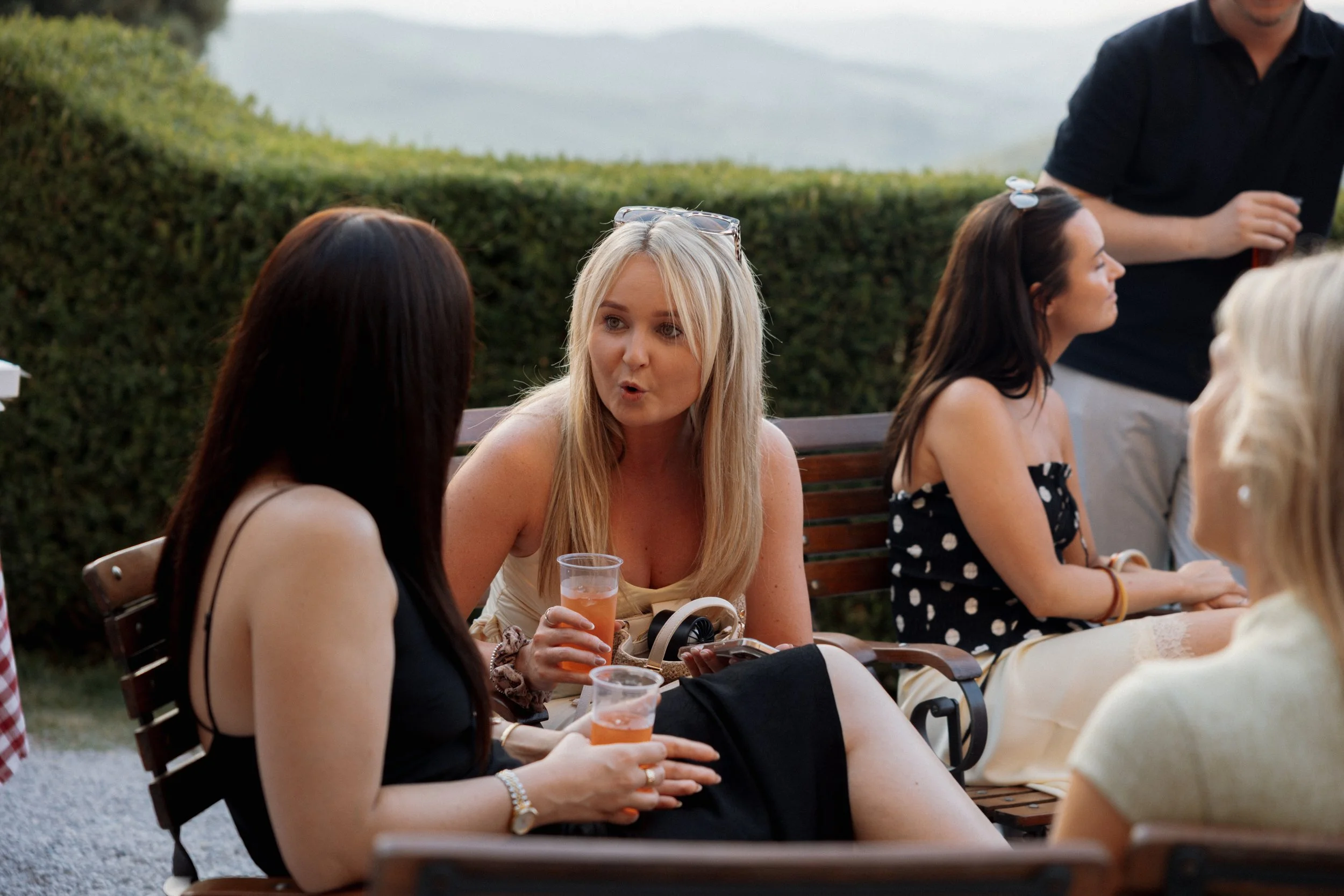 Bride and guests enjoying a pizza welcome party at Borgo di Pietrafitta in Tuscany, Italy