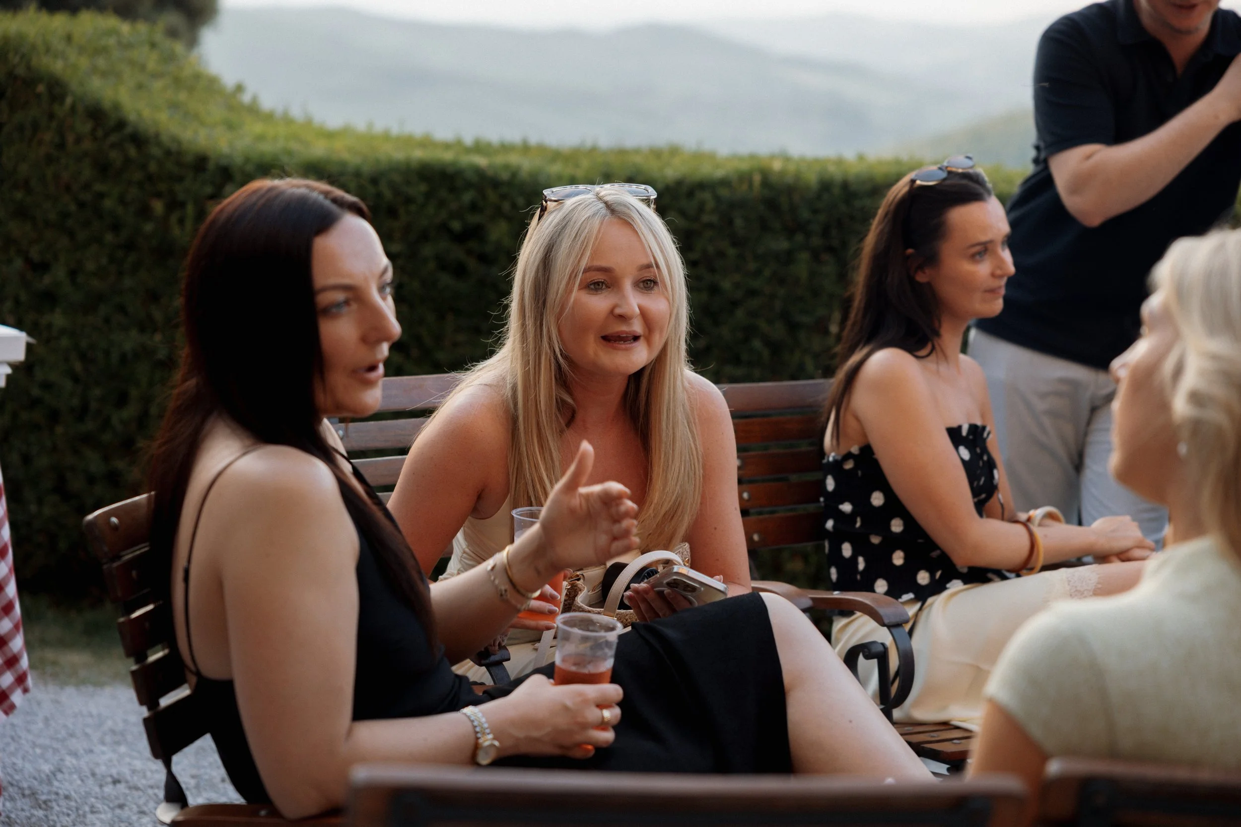 Bride and guests enjoying a pizza welcome party at Borgo di Pietrafitta in Tuscany, Italy