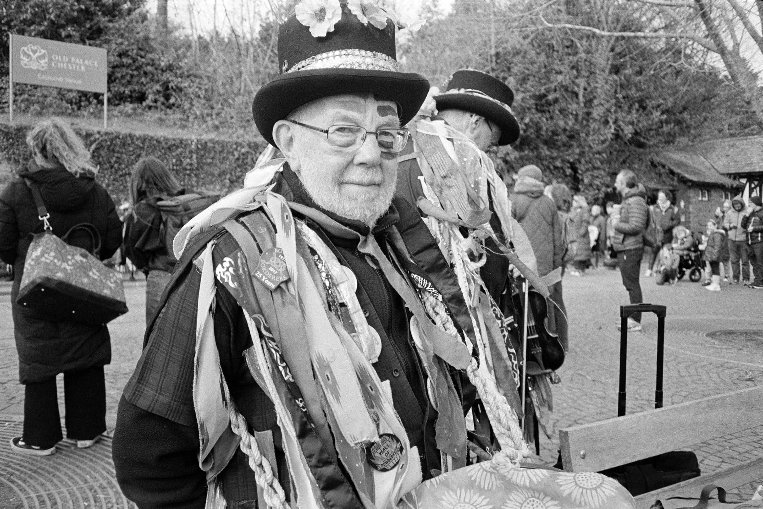 A portrait image of a Morris Dancer in Chester looking towards the camera