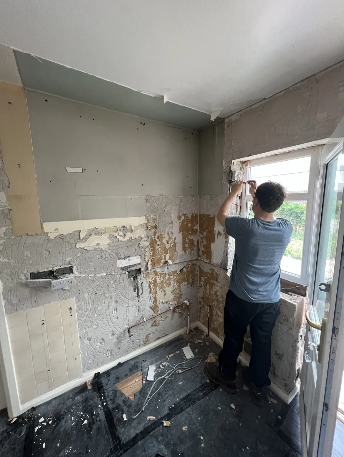 Electrical works being completed by Kitchen Design and Supply as part of a new kitchen installation