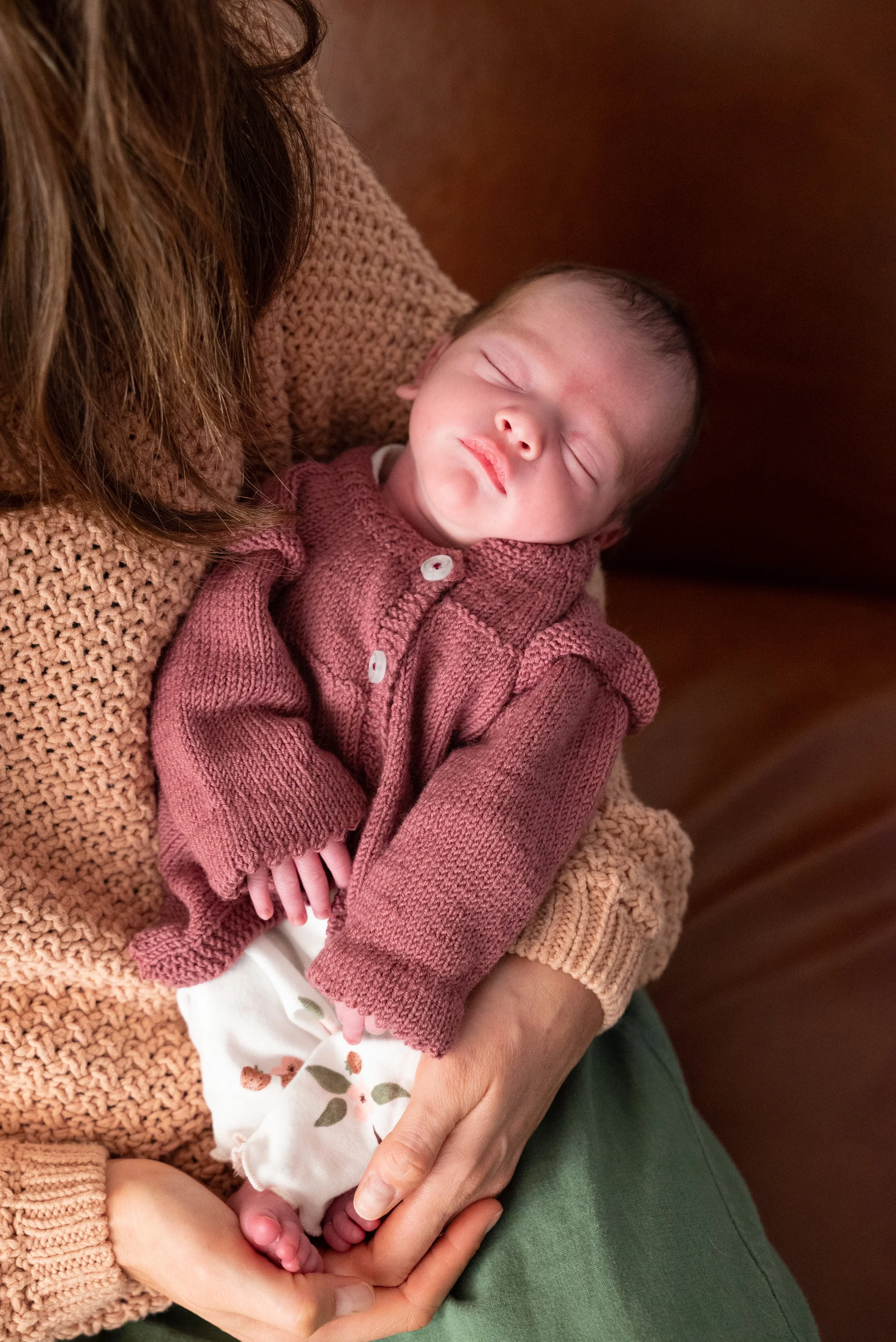 Heidi holding newborn baby in Portland home