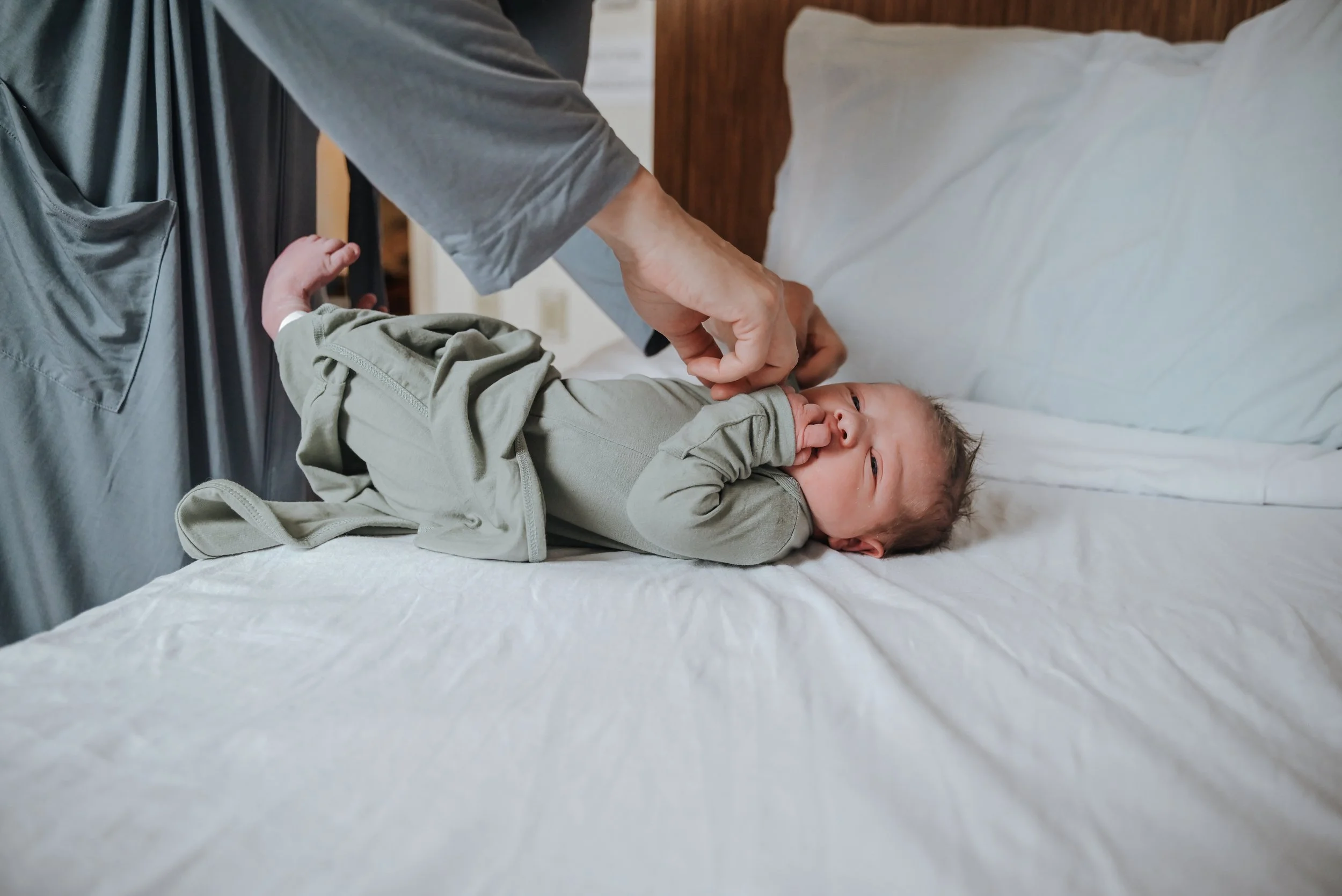 Newborn baby getting dressed at a Portland Hospital