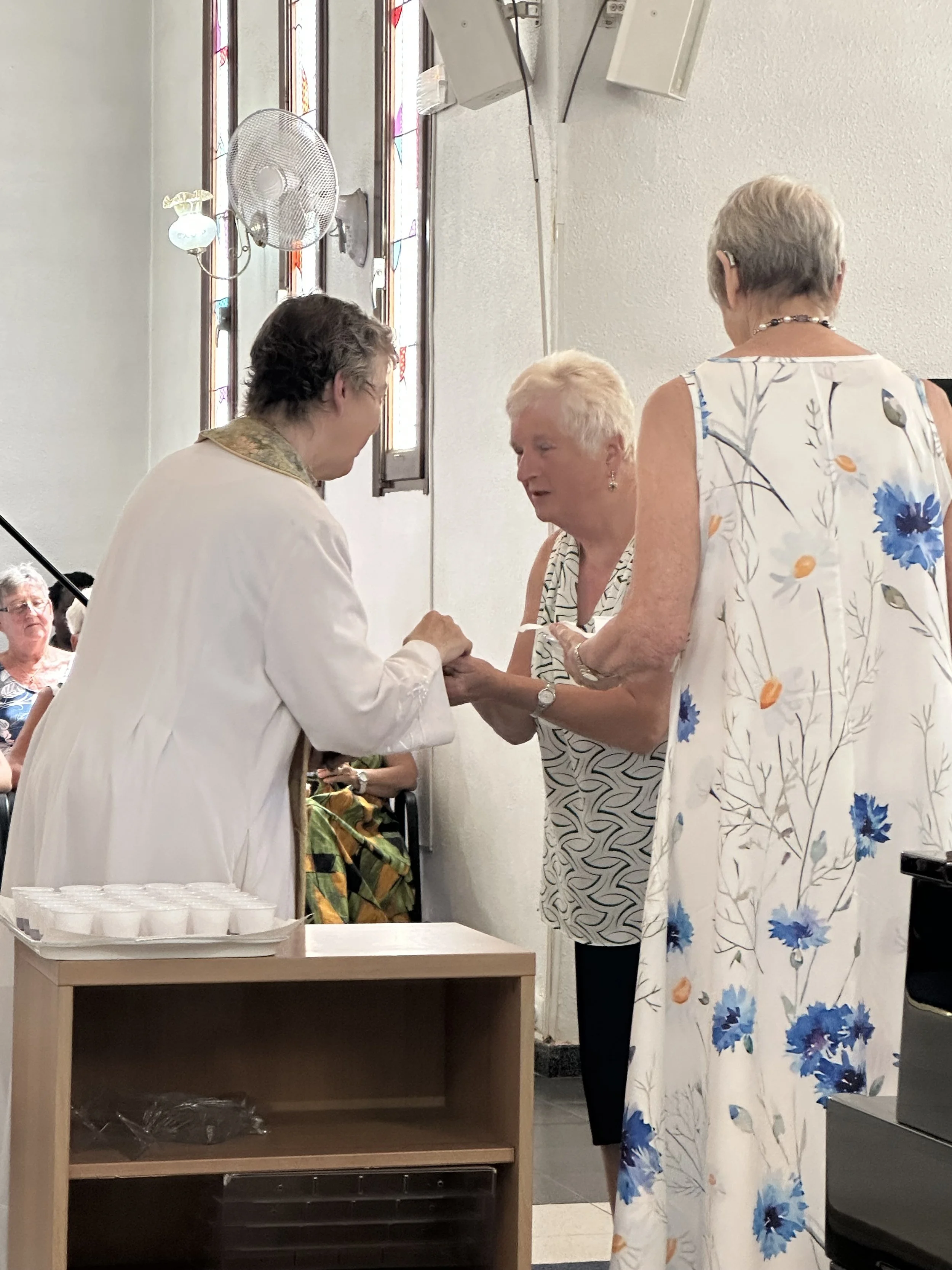 Serving Communion (July 2025).jpeg