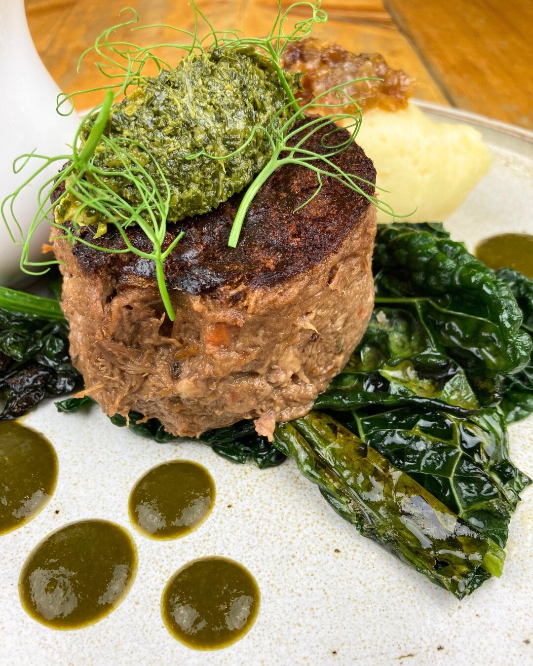 Slow-cooked shoulder of lamb, buttermilk mash, salsa verde, parsley puree, cavolo nero 

🍲 Check out our menu and book a table (links in bio)