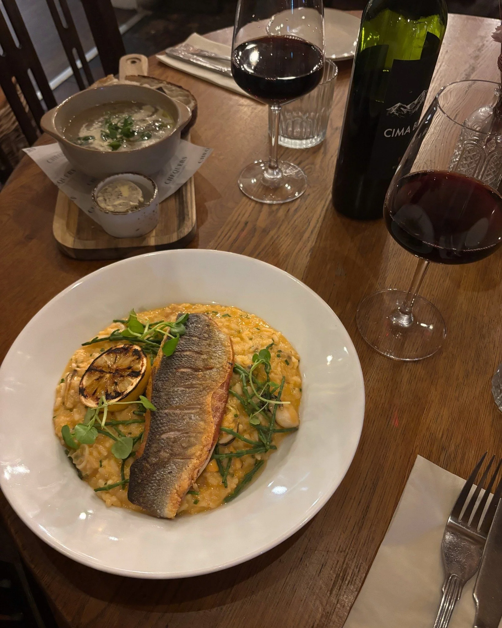 Sea bass fillet, mussel, clam, squid &amp; prawn bisque risotto, samphire &amp; lemon zest 🍋

🍽️ Menus &amp; Bookings: chequerscutnallgreen.co.uk