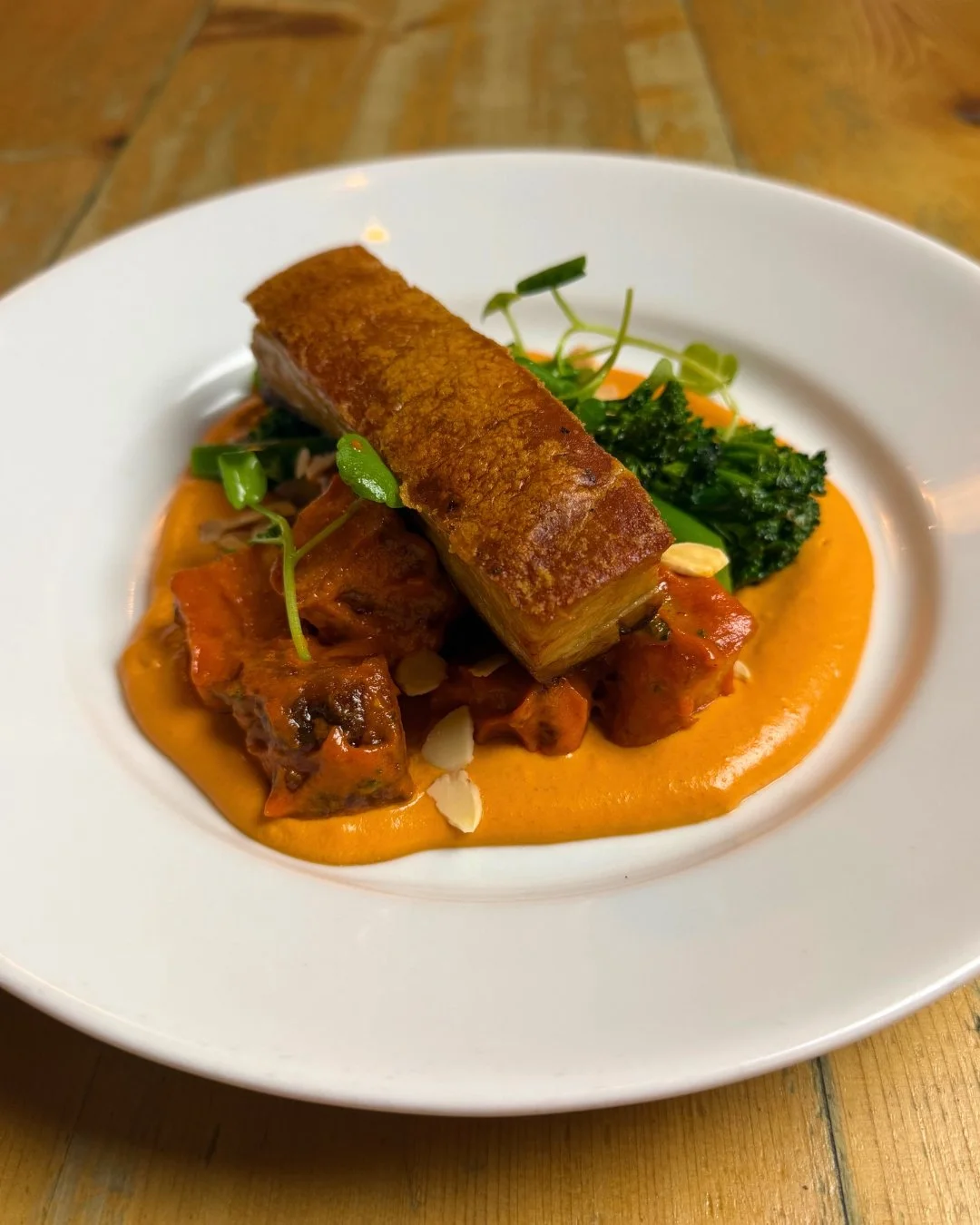 Available on our lunch and dinner menu- sherry glazed pork belly with patatas bravas, tender stem and romesco sauce. 

🍽️ Menus &amp; Bookings: chequerscutnallgreen.co.uk or 01299 851292