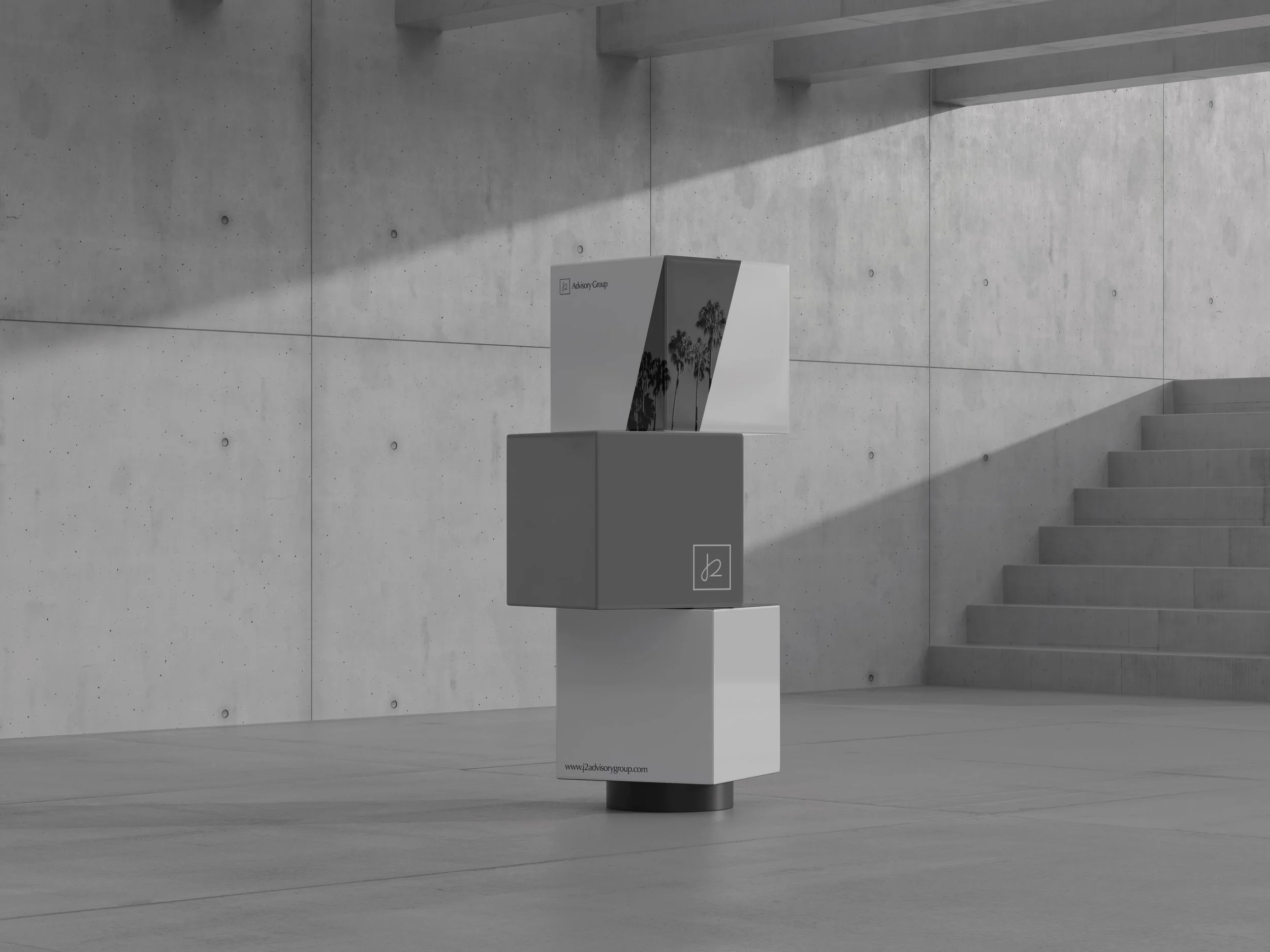 A freestanding display box with a brochure or booklet on top, situated on a concrete floor in an industrial-style space with a concrete wall and stairs in the background.