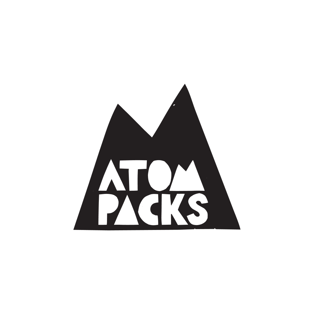 A black mountain-shaped logo with the words 'ATOM PACKS' in white, stylized letters inside.