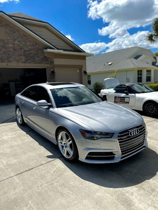 Silver sedan finished with premium auto detailing & paint protection by Christal Clean in Palm Coast