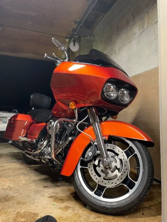 Orange motorcycle detailed with chrome polishing & paint enhancement by Christal Clean in Palm Coast