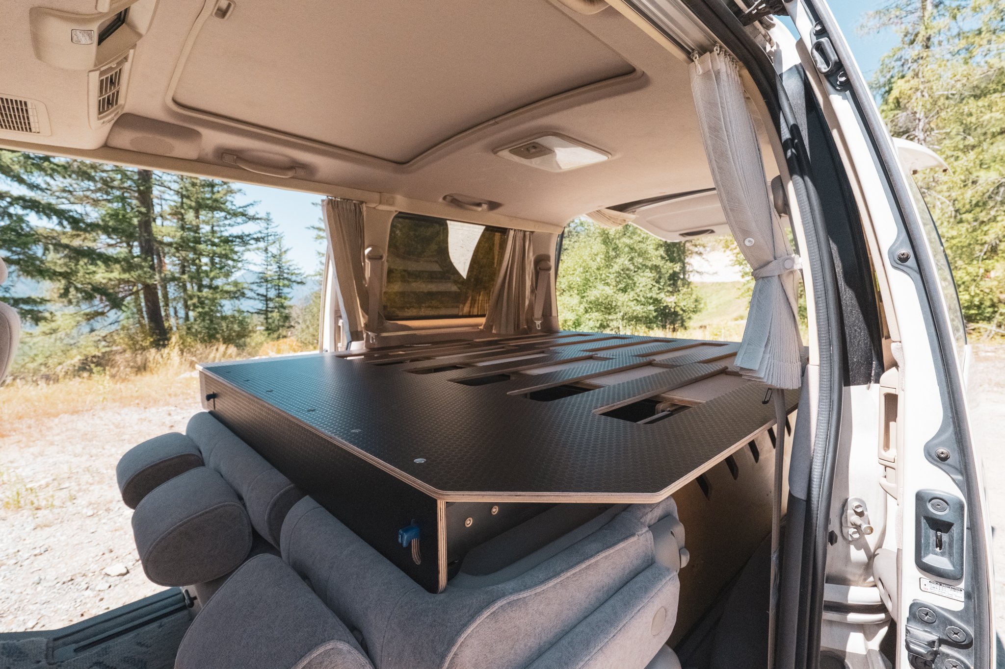 Bed platform in a drop in camping module from Habitat Vans. Install in Delica or Hiace.