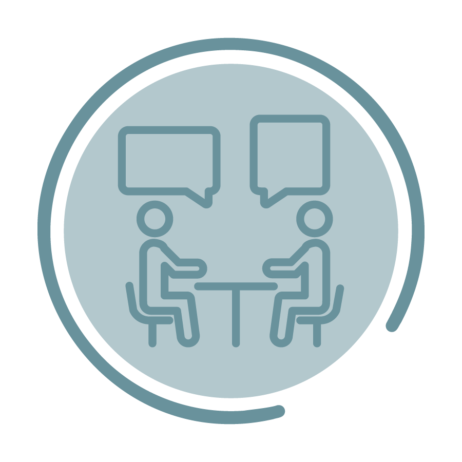 A blue circle icon outlining two people sitting at a table and talking.