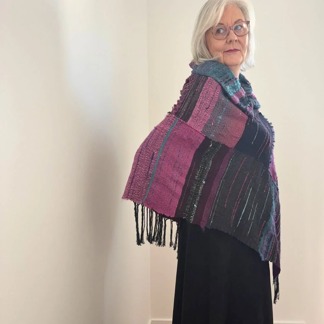 purple teal poncho over shoulder.jpg