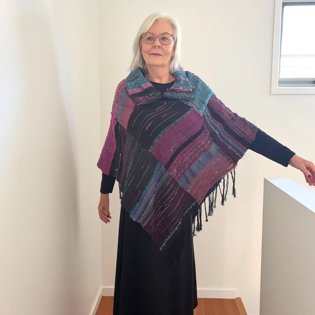 purple teal poncho arm out.jpg