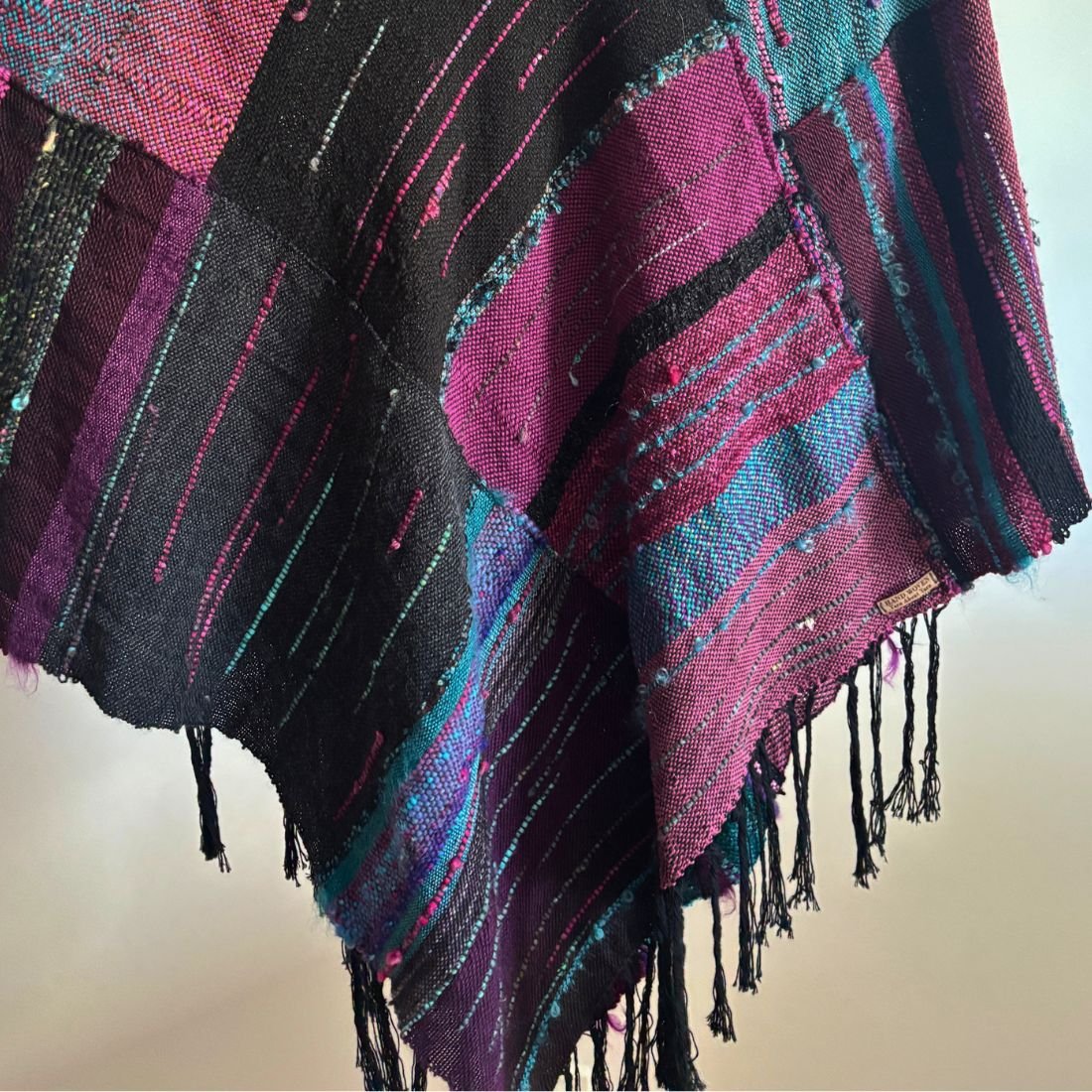 purple teal poncho on hanger bottom.jpg