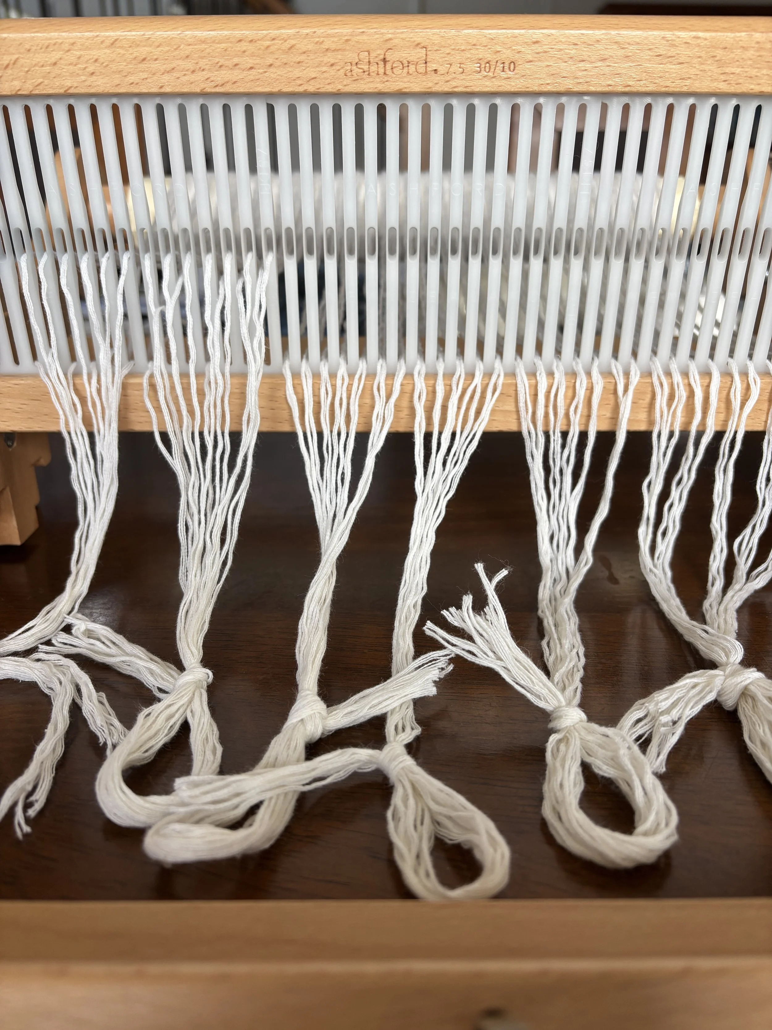 warping a rigid heddle loom.JPG