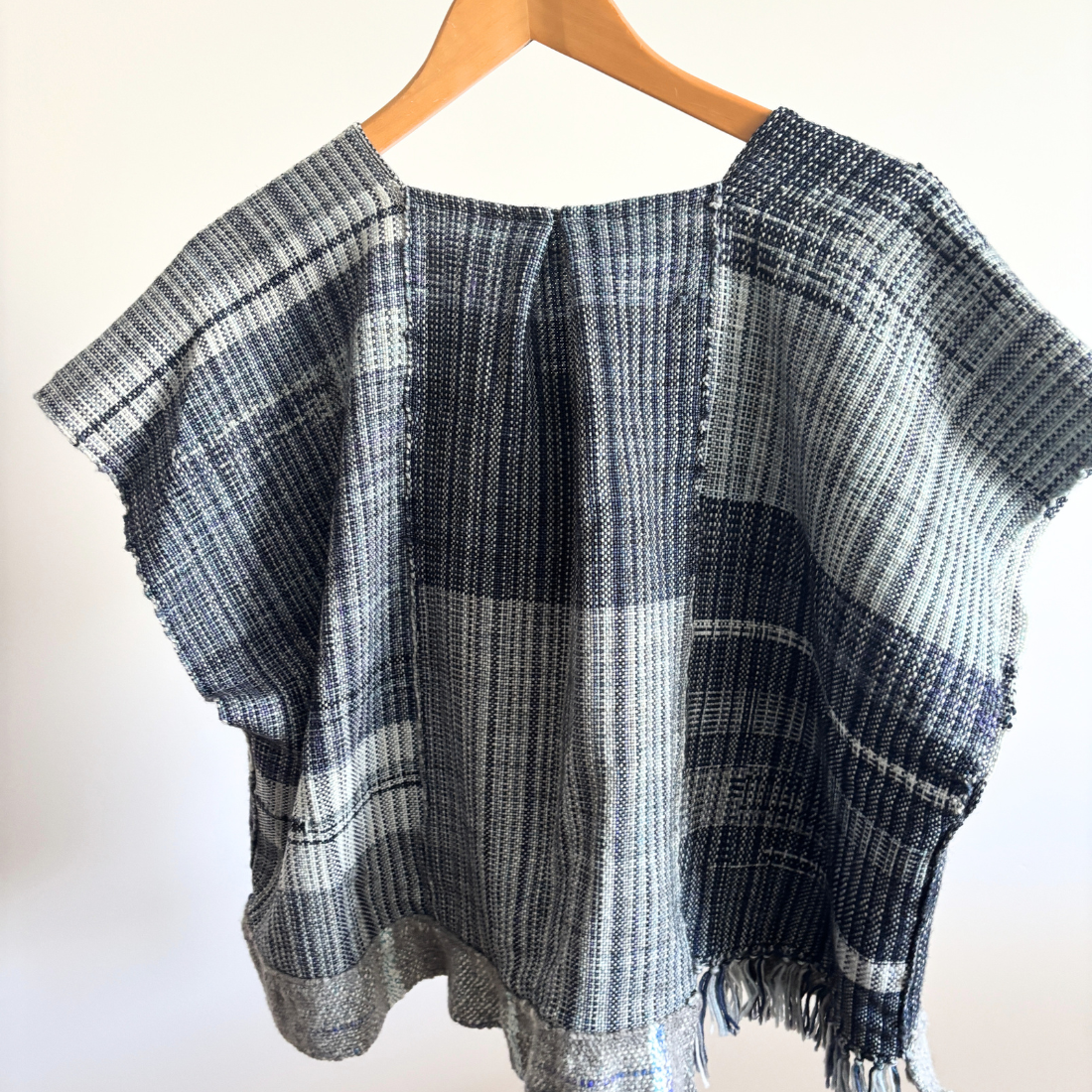 blue woven top back on hanger.png