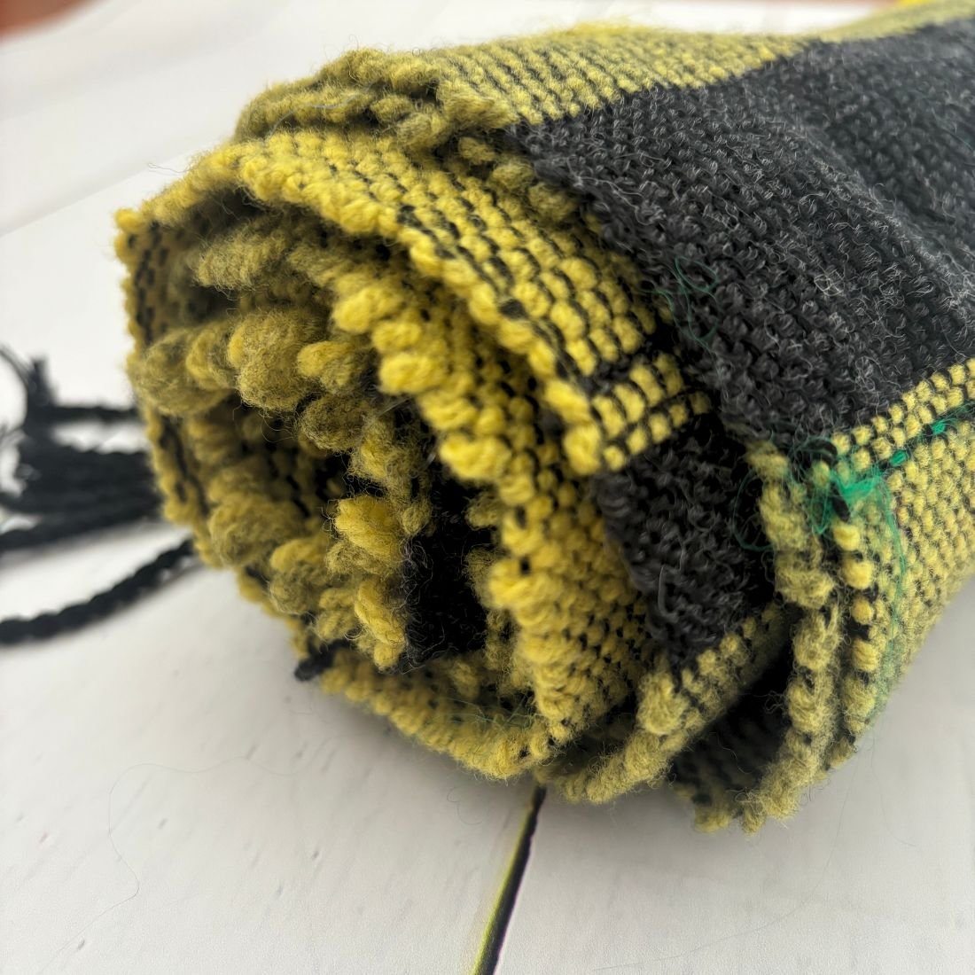 yellow green scarf rolled closeup.jpg