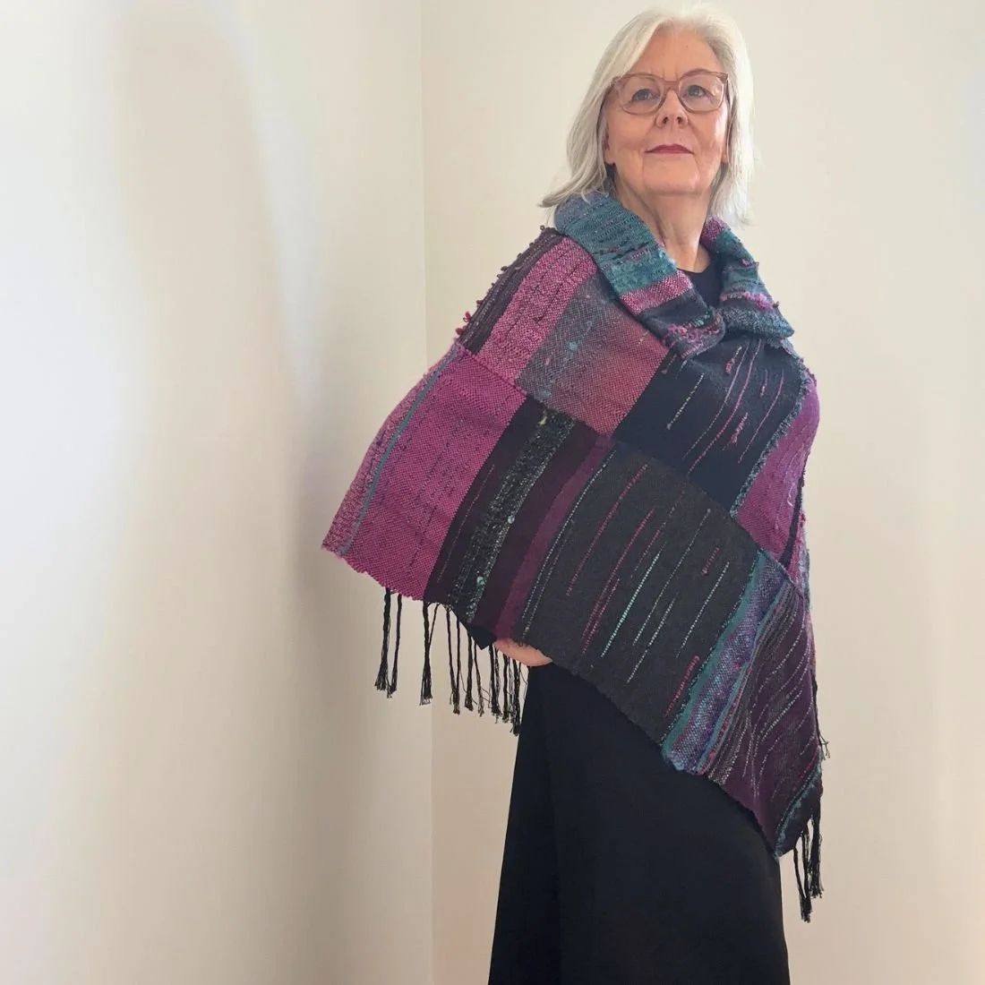 purple teal poncho looking up.jpg