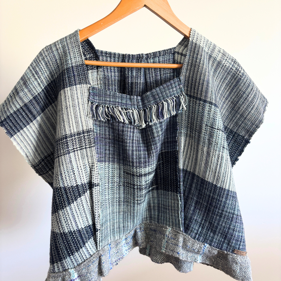blue woven top front on hanger.png